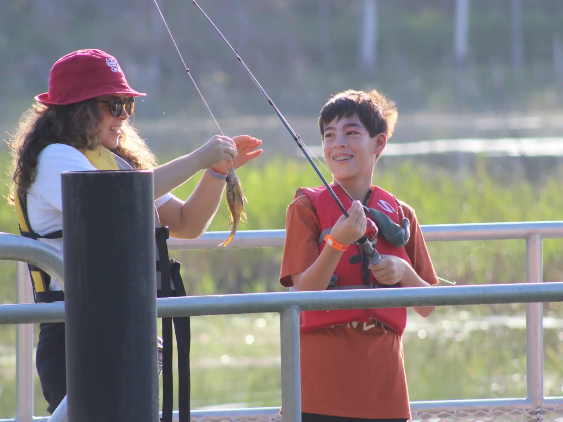 a boy and girl fishing