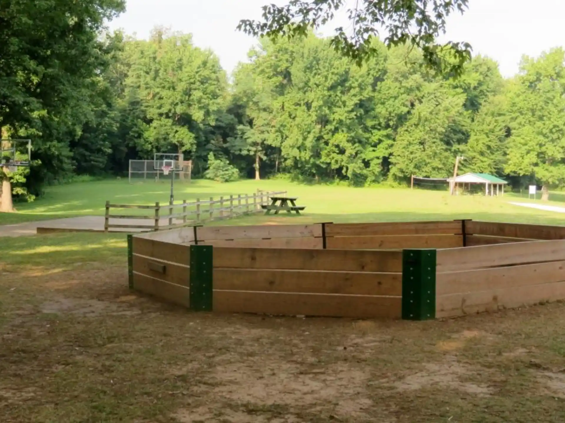 a wooden structure in a field