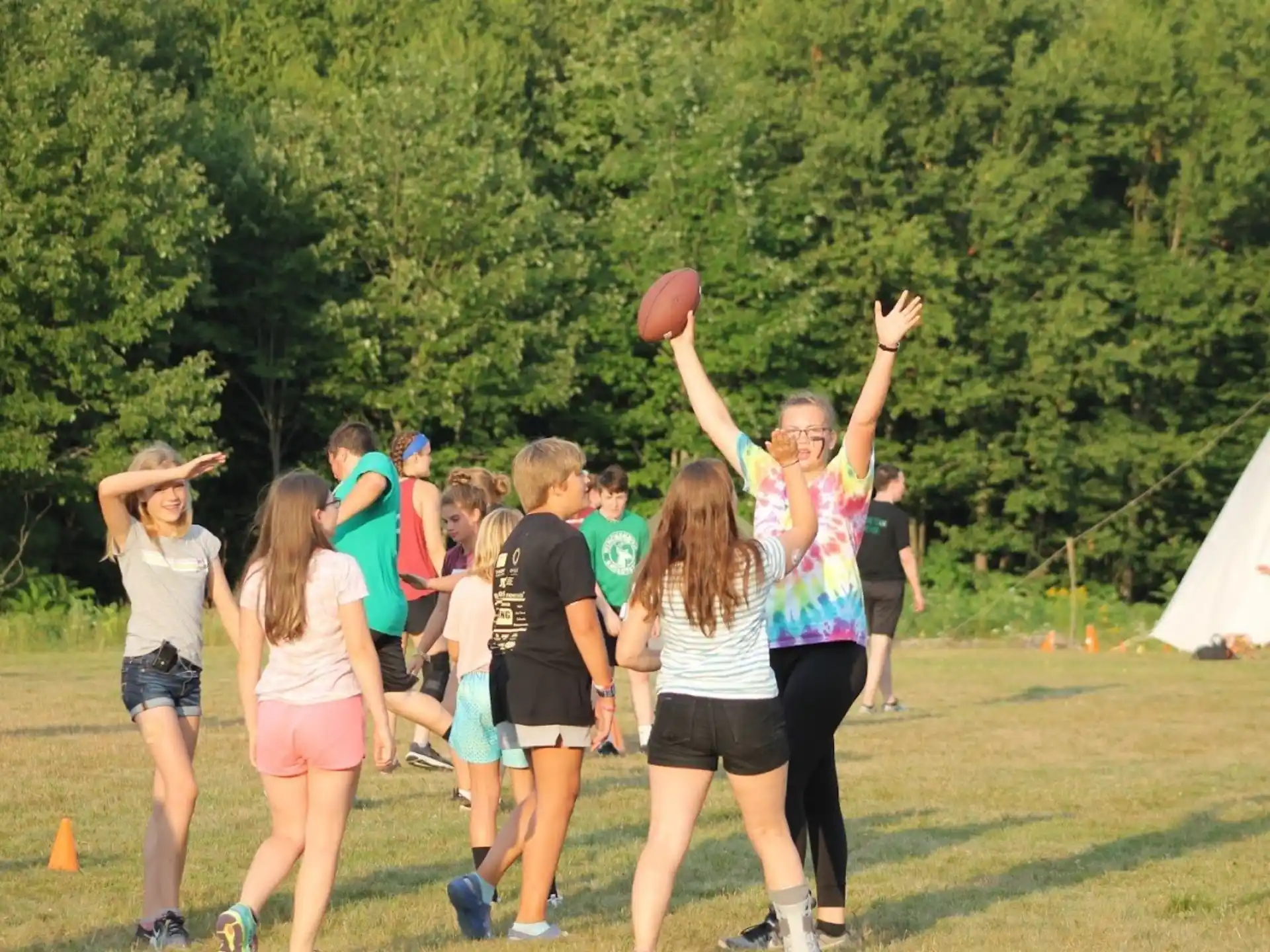 a group of people playing basketball