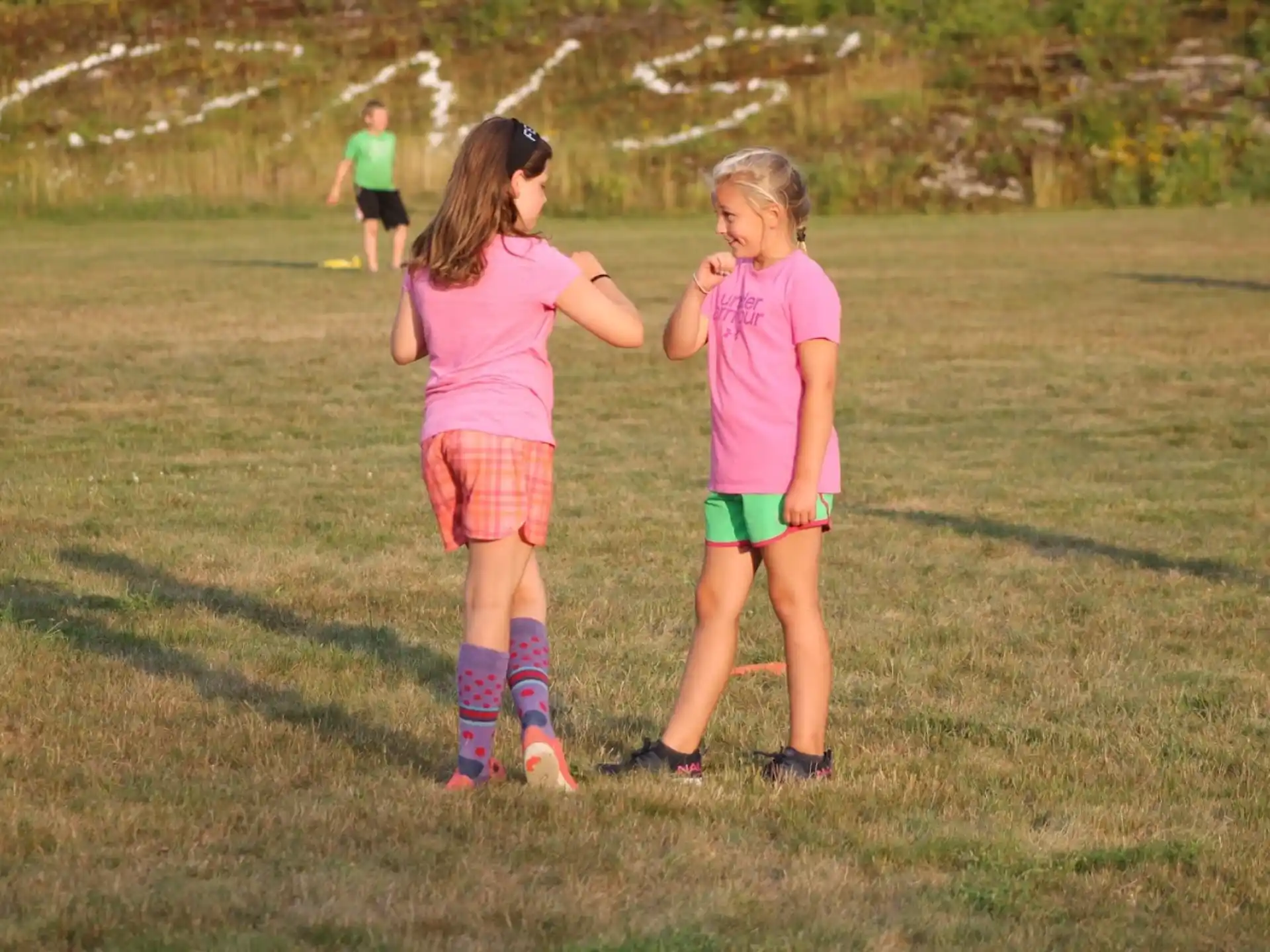 two girls in a field