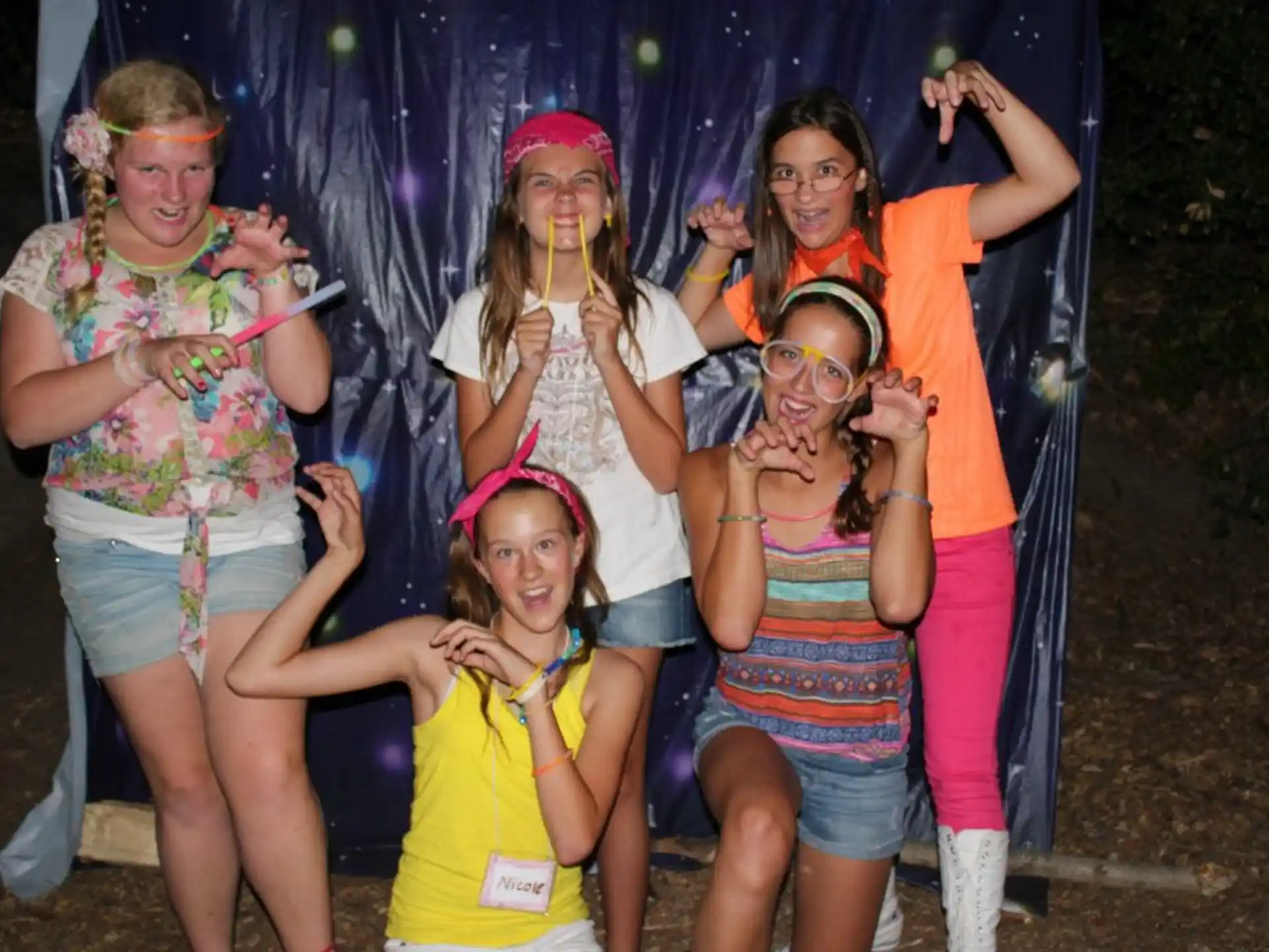 a group of girls posing for a photo
