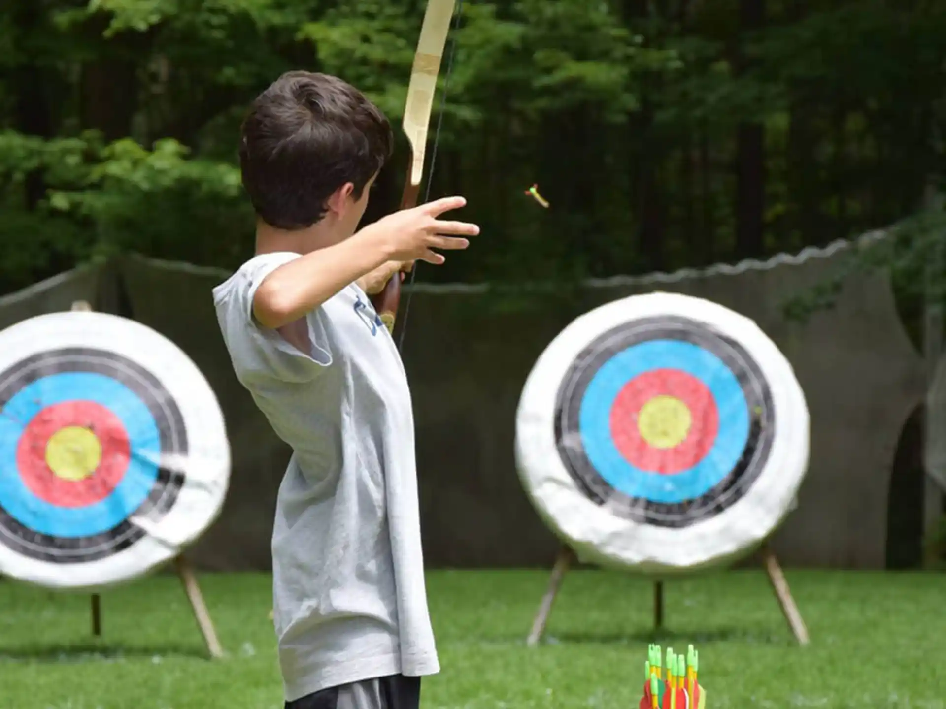 a boy shooting a target