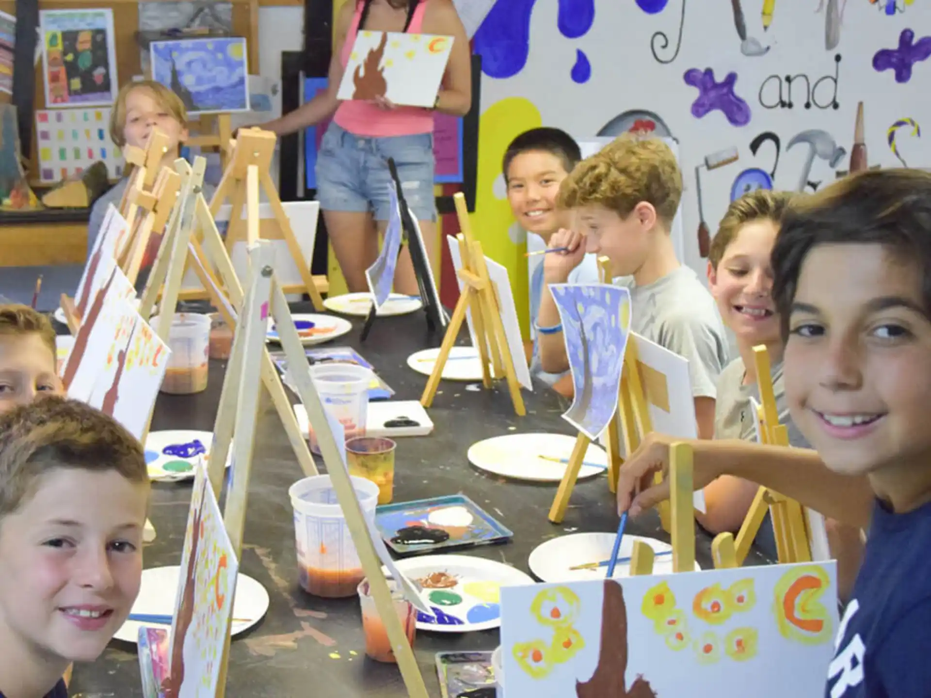 a group of children painting