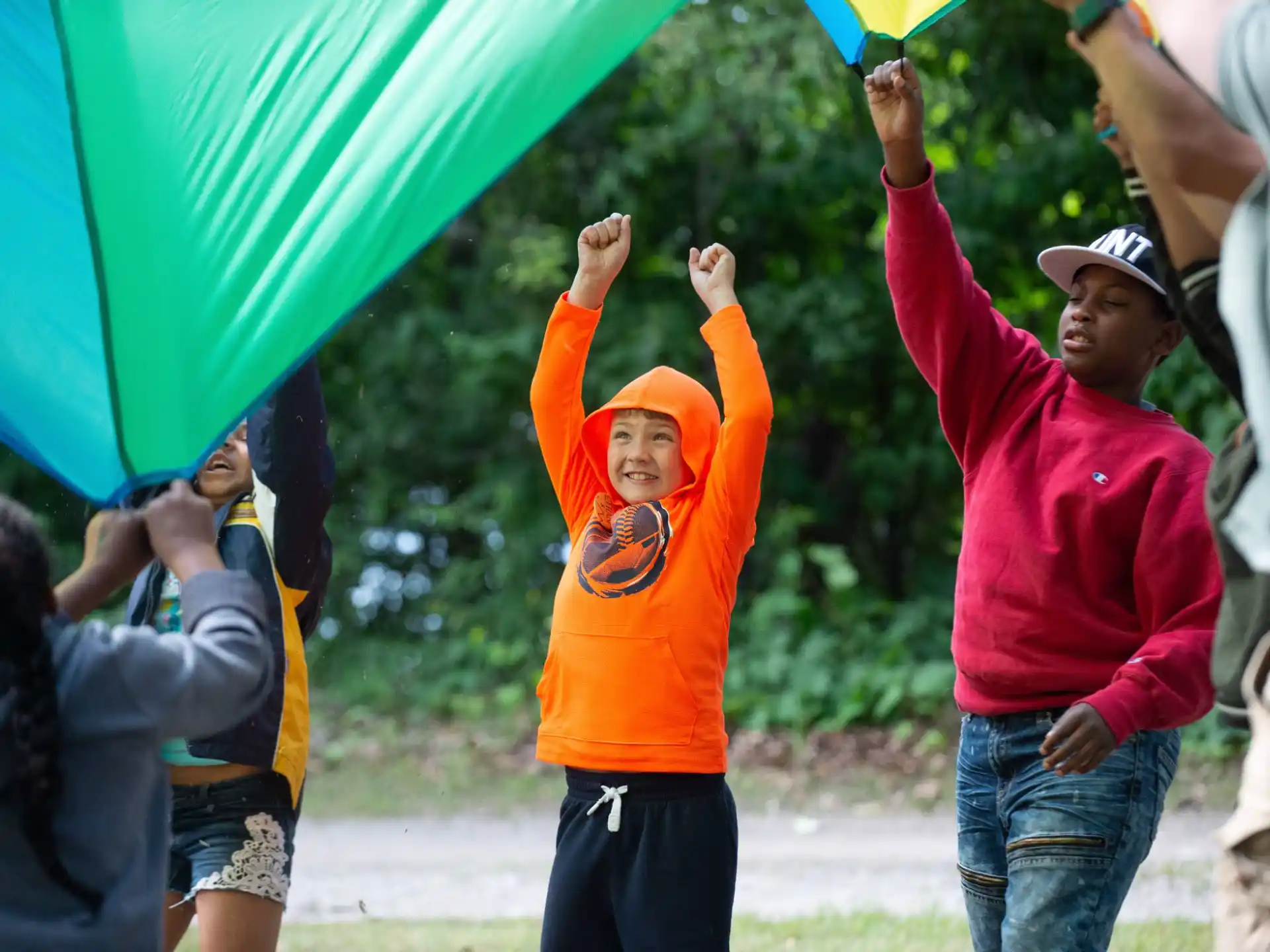 a group of people holding a kite