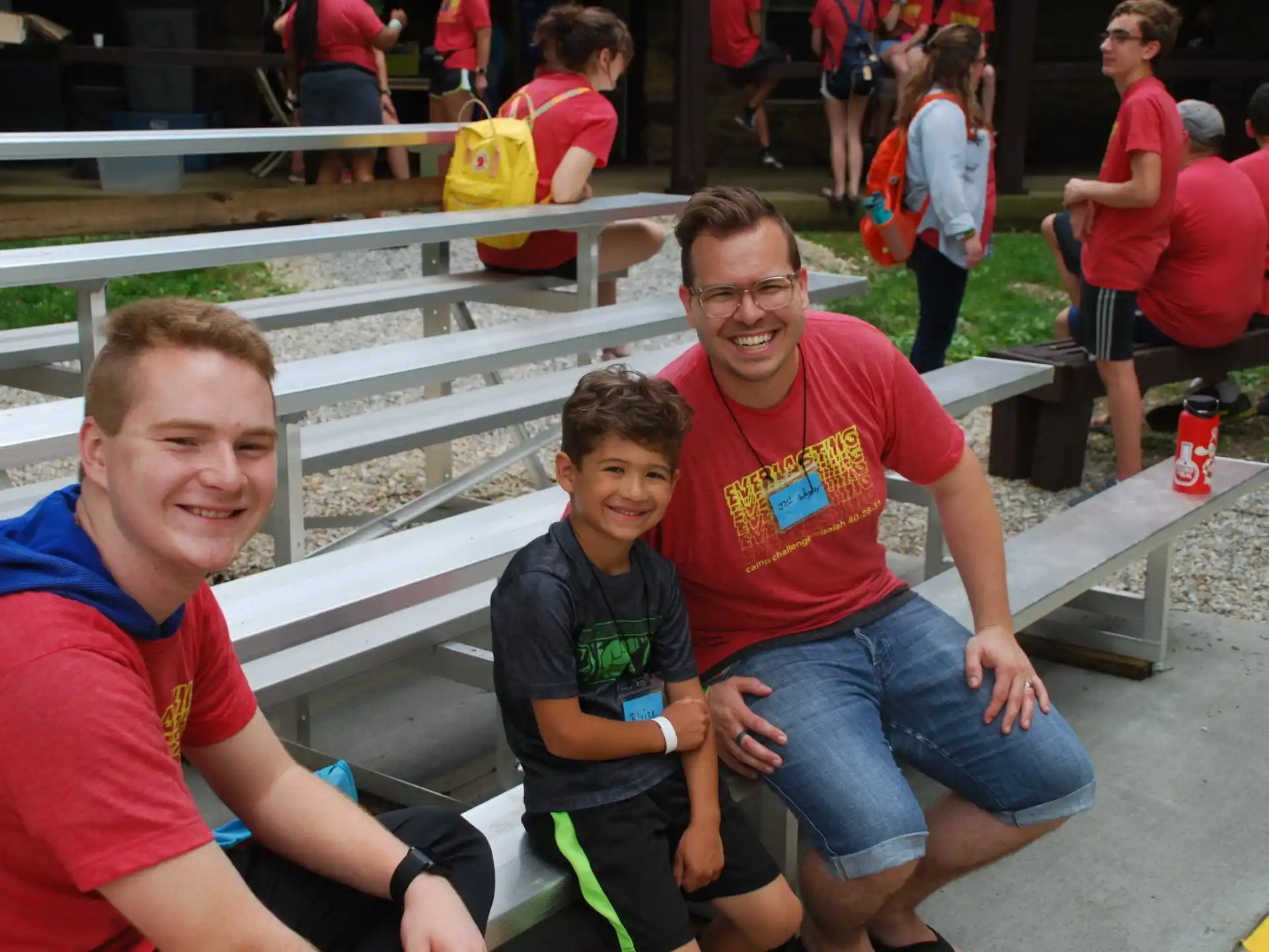 a group of people sitting on a bench