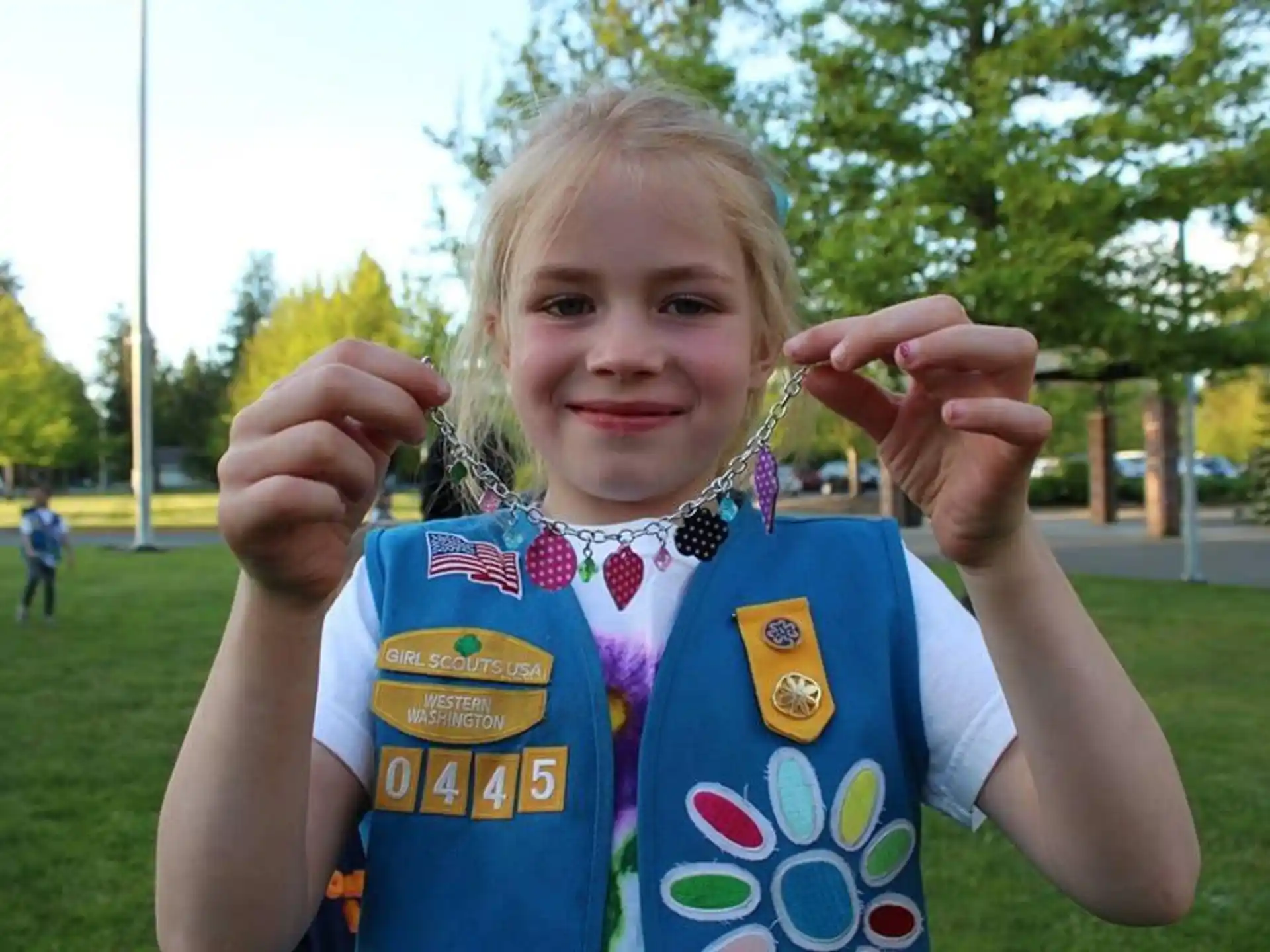 a girl holding up her hands