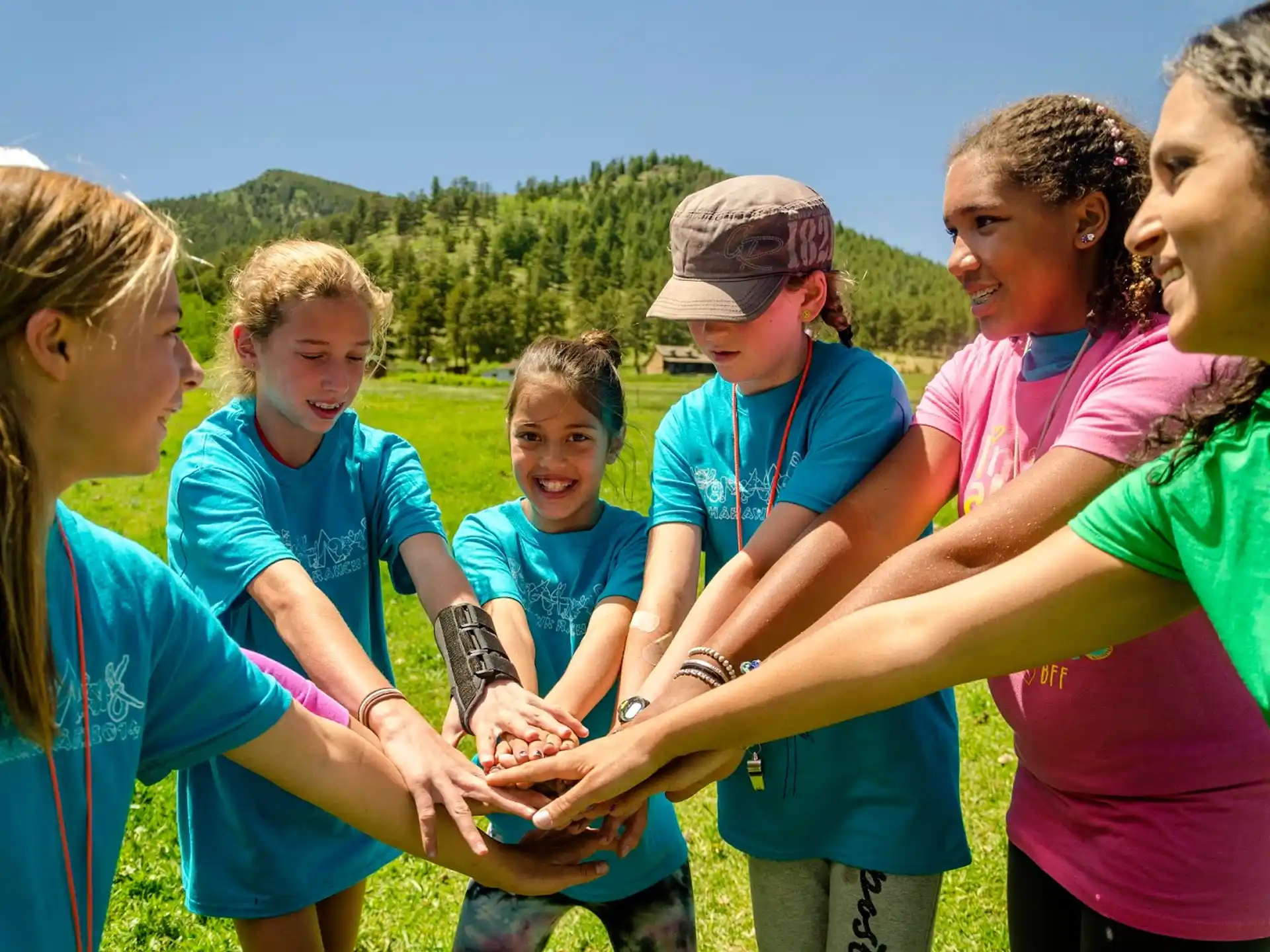 a group of young girls in matching t-shirts