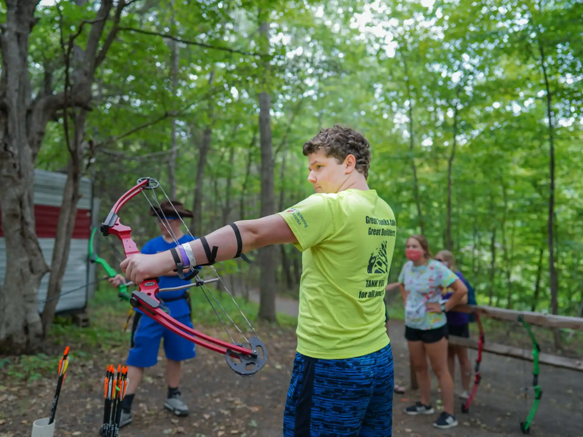 a man holding a bow and arrow