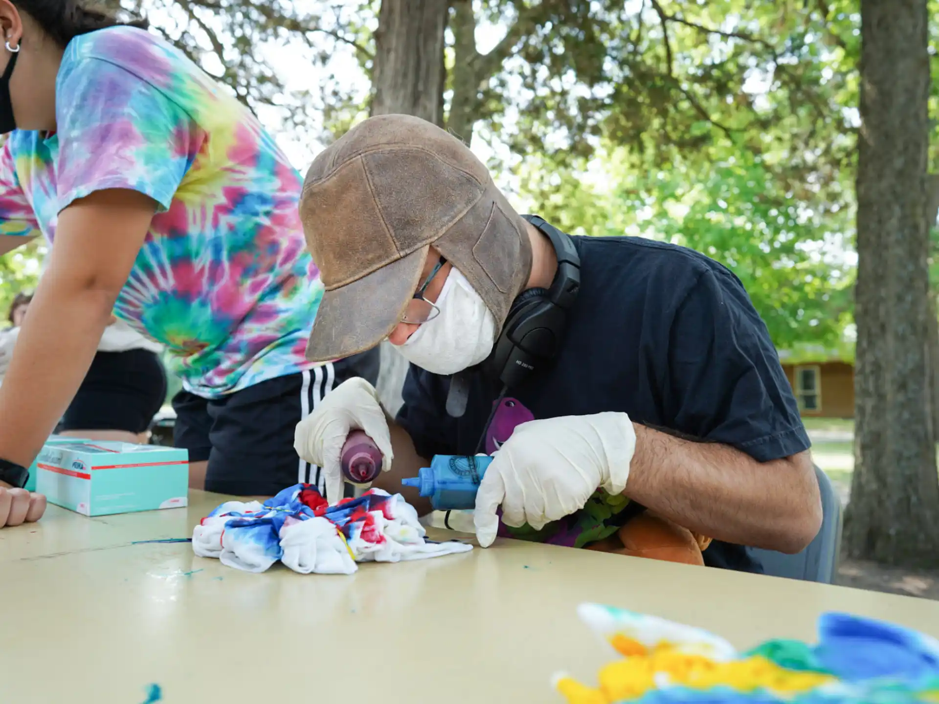 a person wearing a hat and gloves