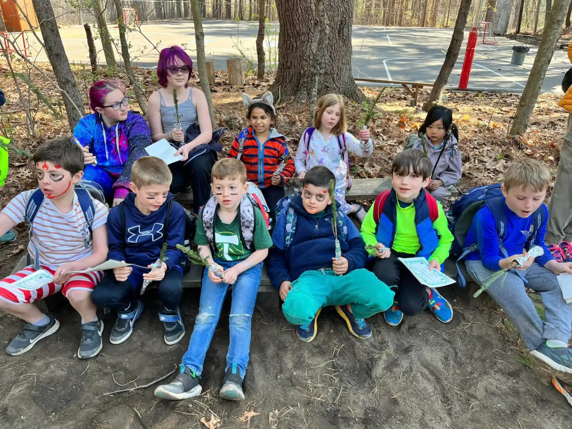 a group of people sitting on the ground
