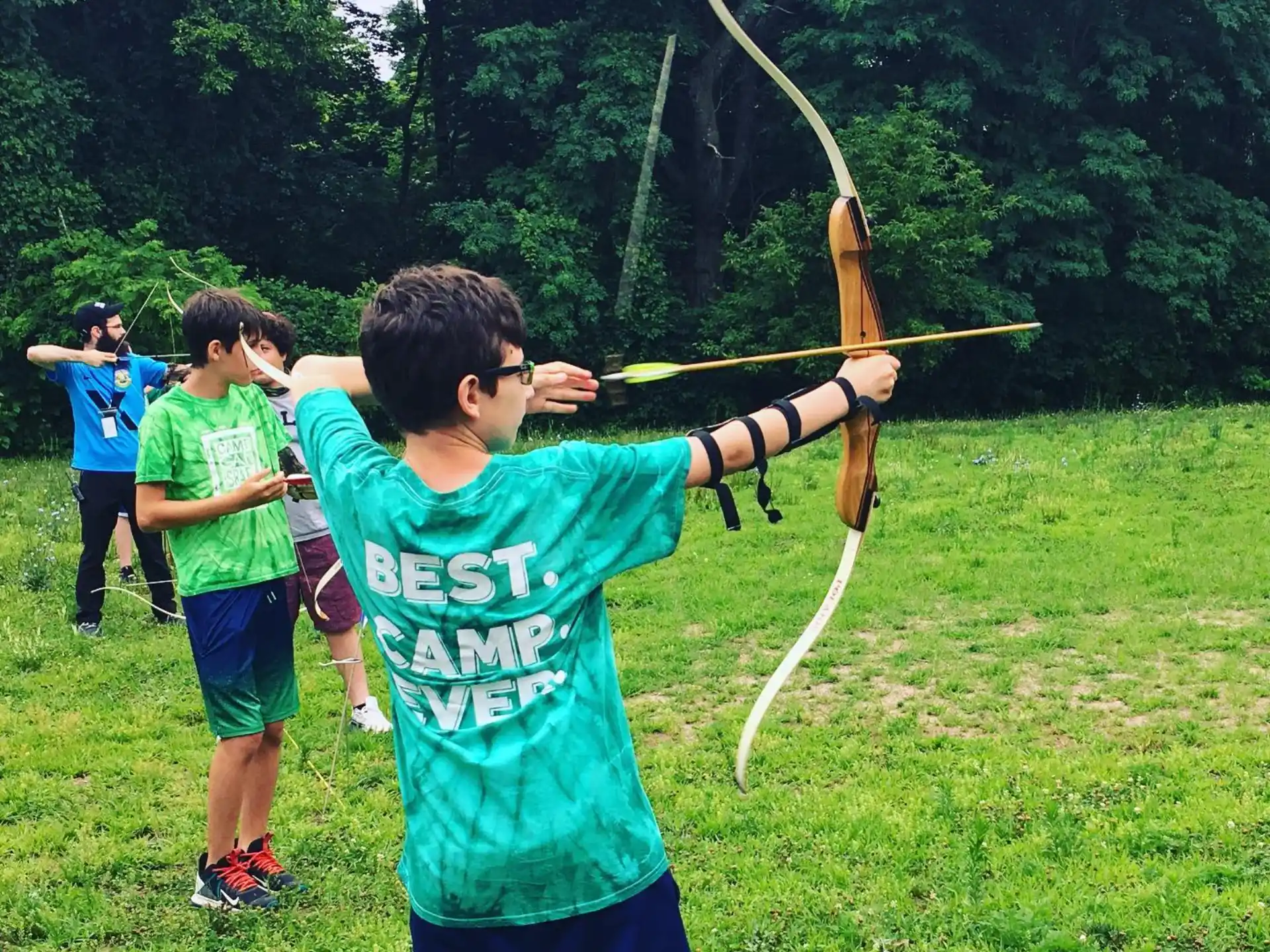 a group of people holding a bow and arrow
