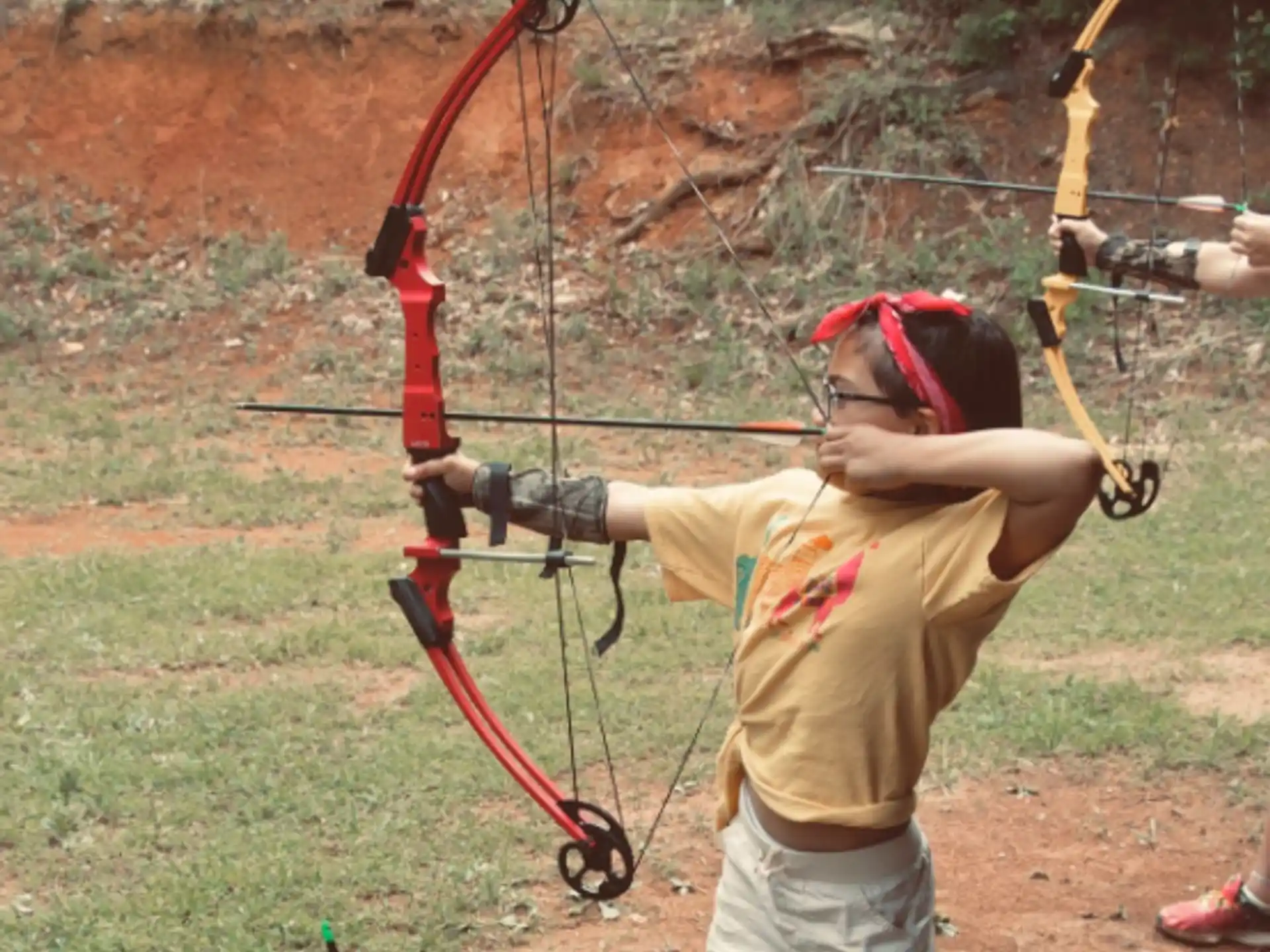 a person shooting a bow and arrow