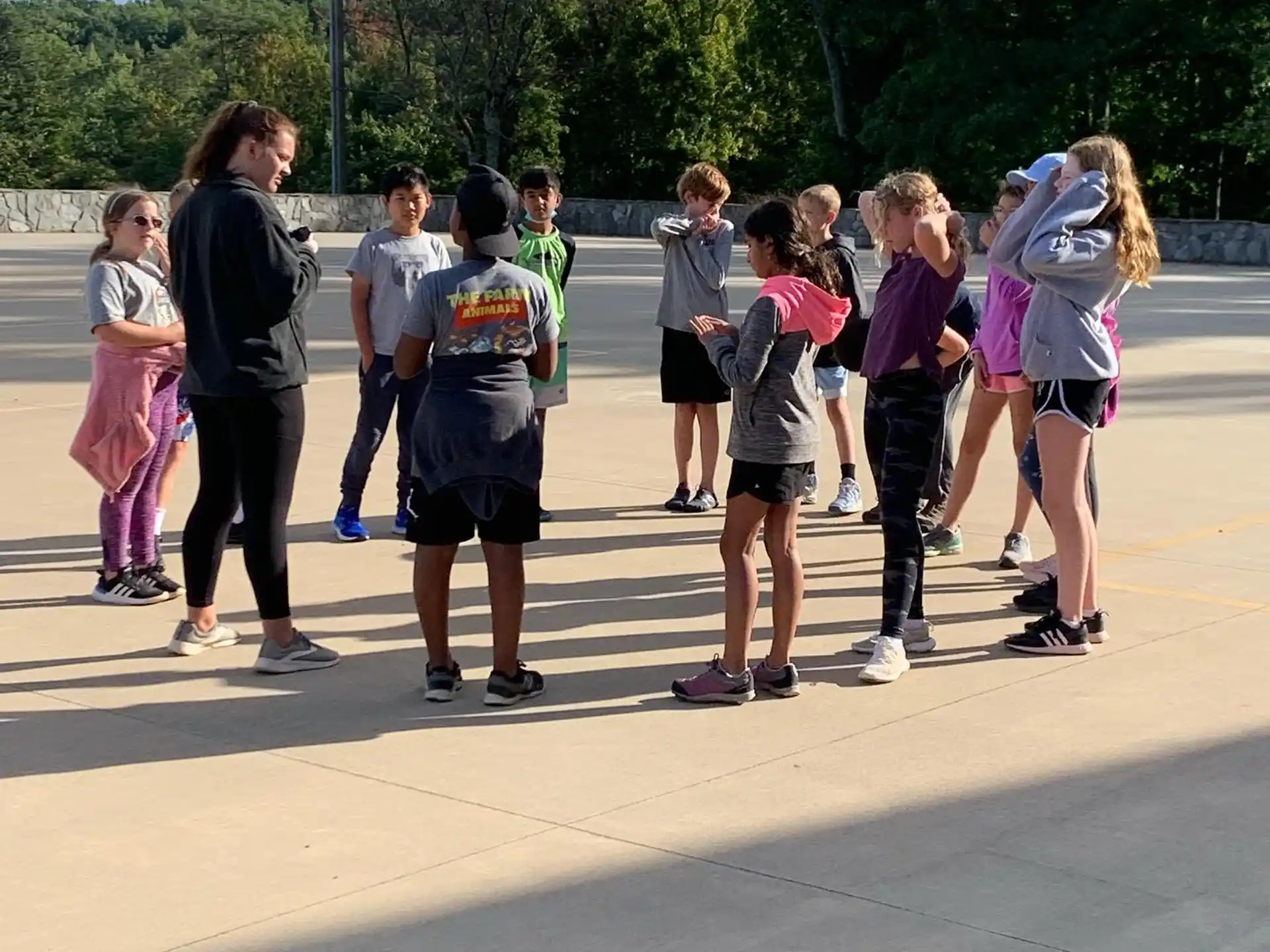 a group of people standing on a concrete surface