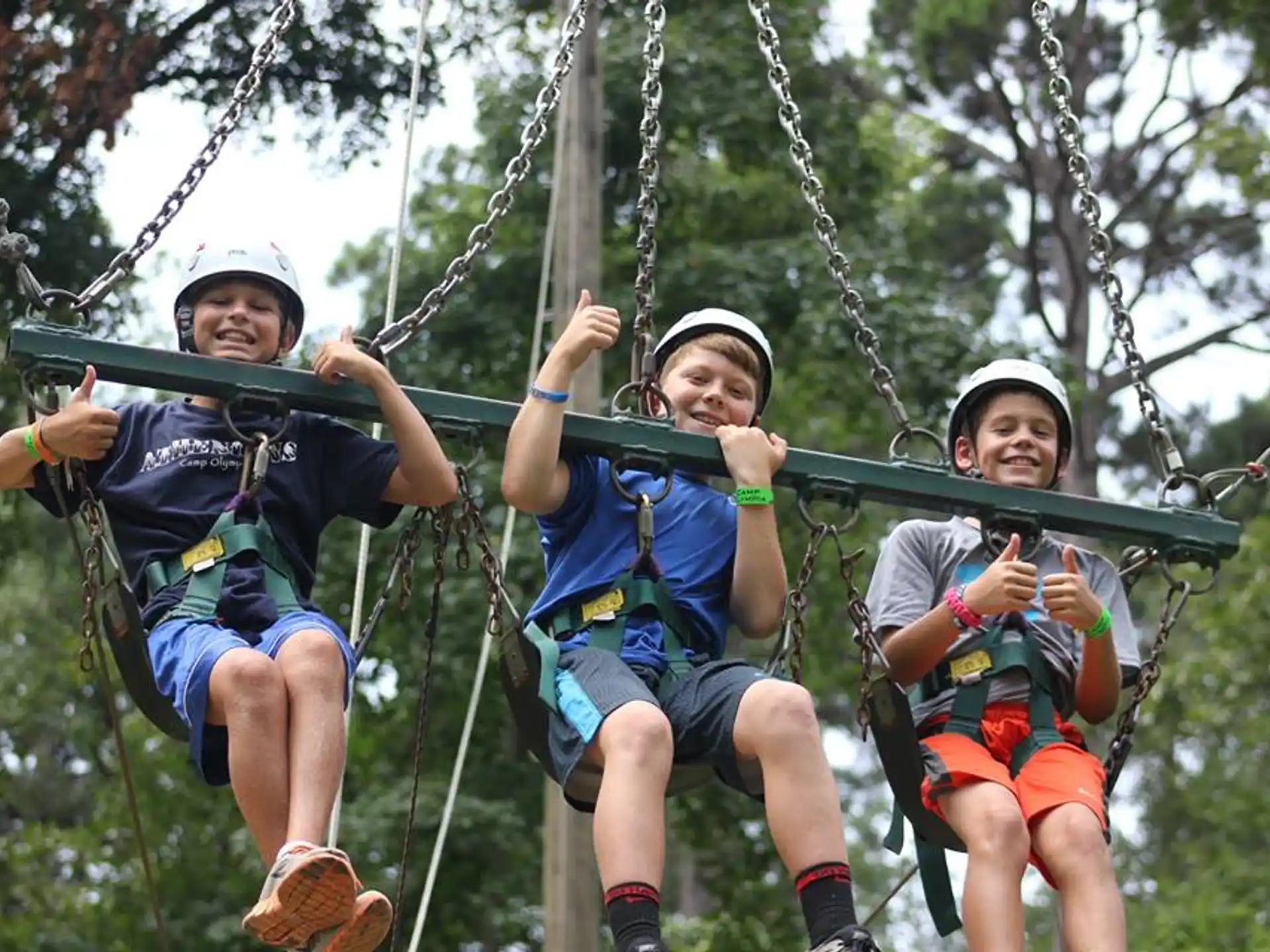 a group of kids on a swing