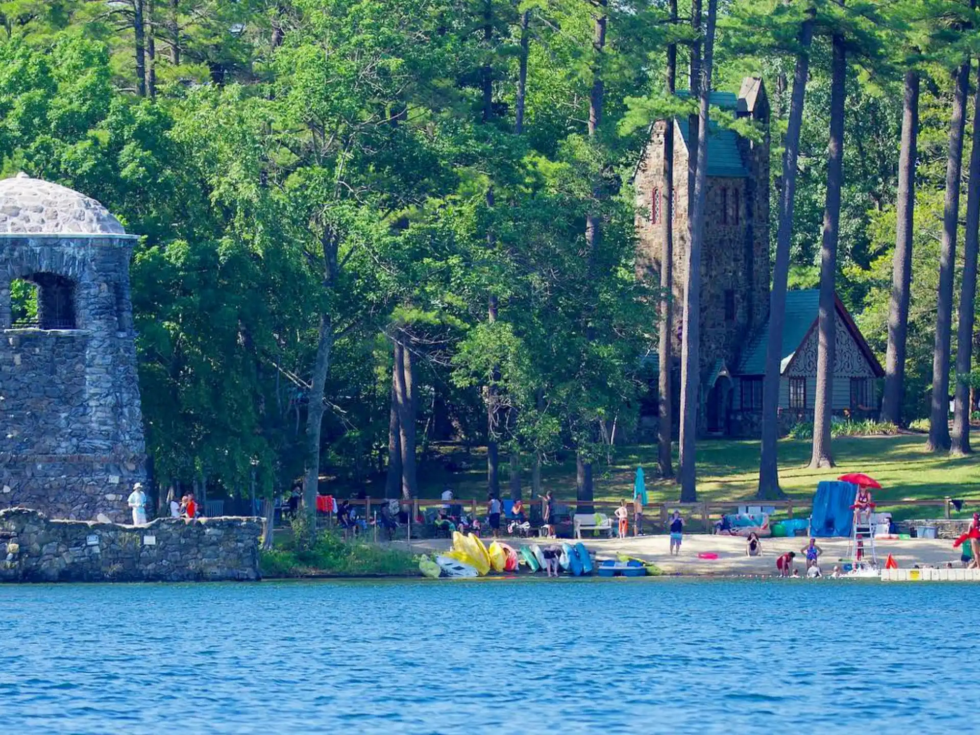 a body of water with a building and trees around it