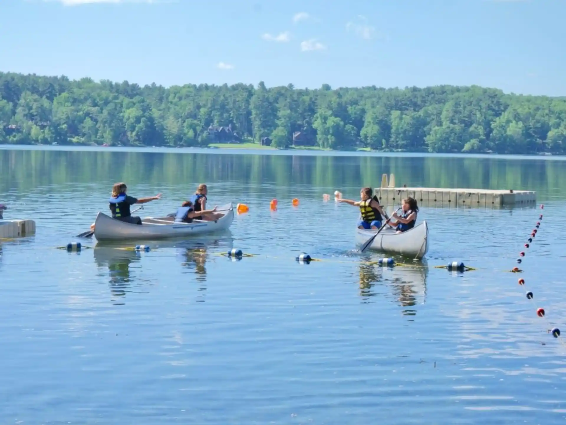 people in boats on water
