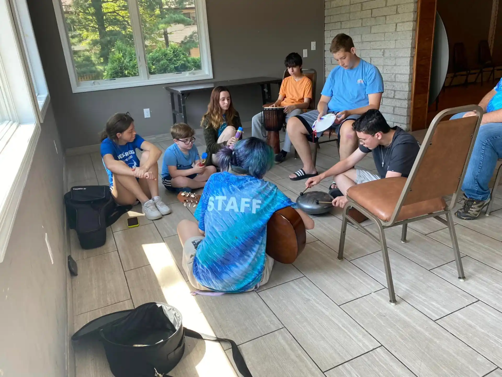 a group of people sitting on the floor
