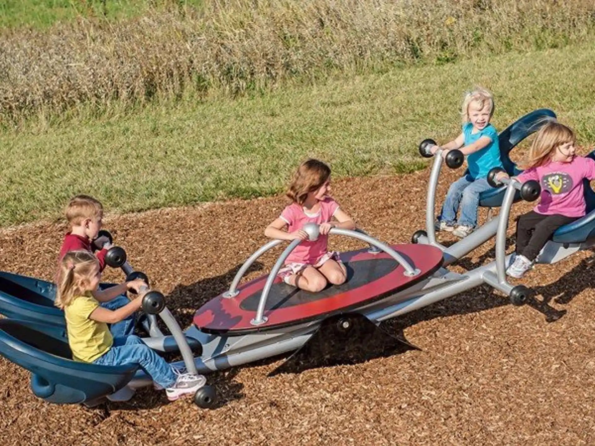 a group of children on a lawnmower