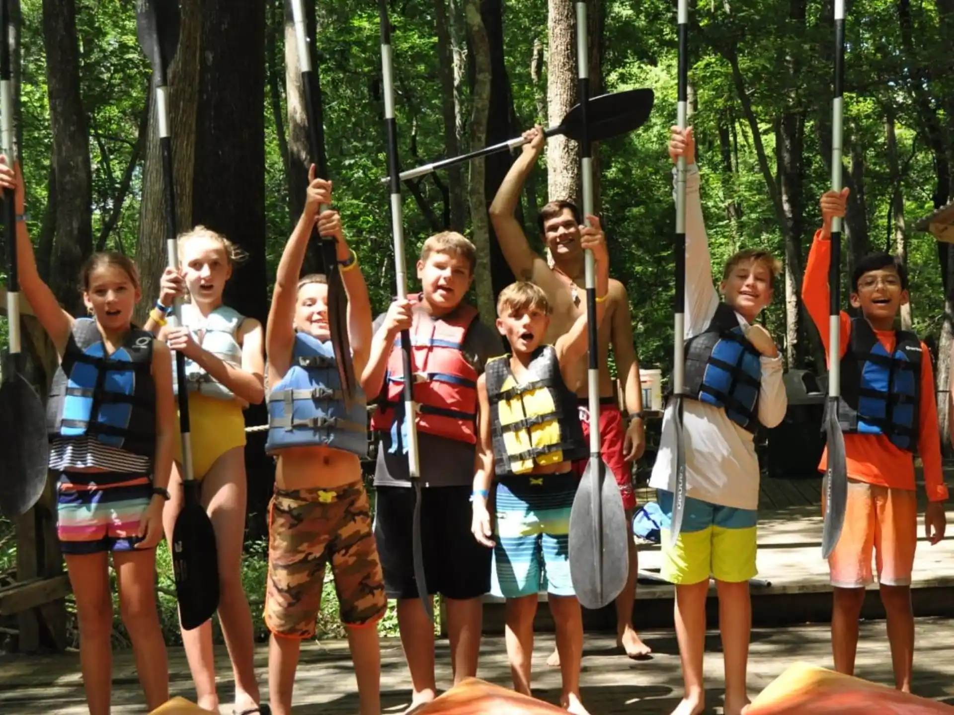 a group of people holding up their hands