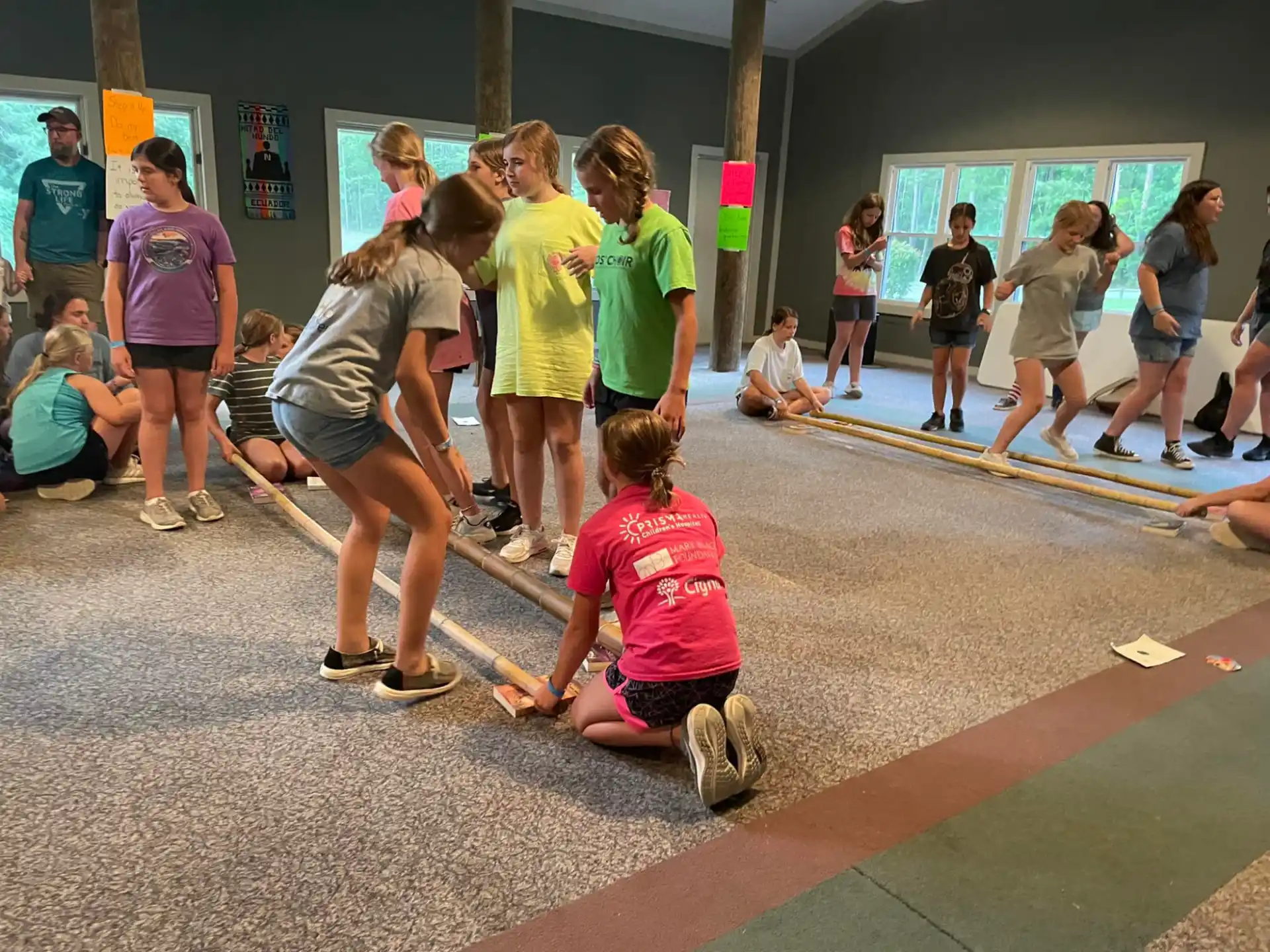 a group of people playing with a broom