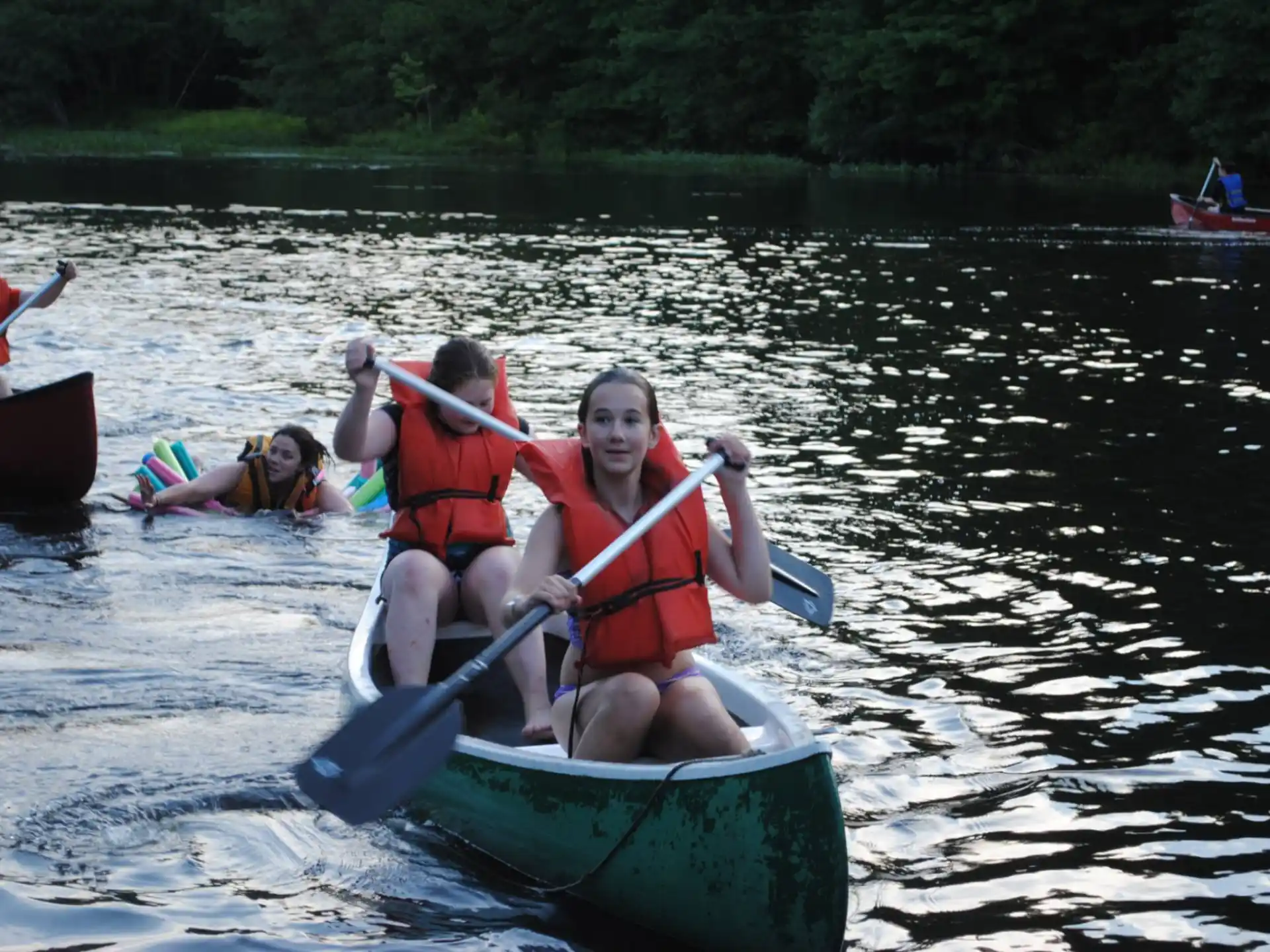 a group of people in a canoe