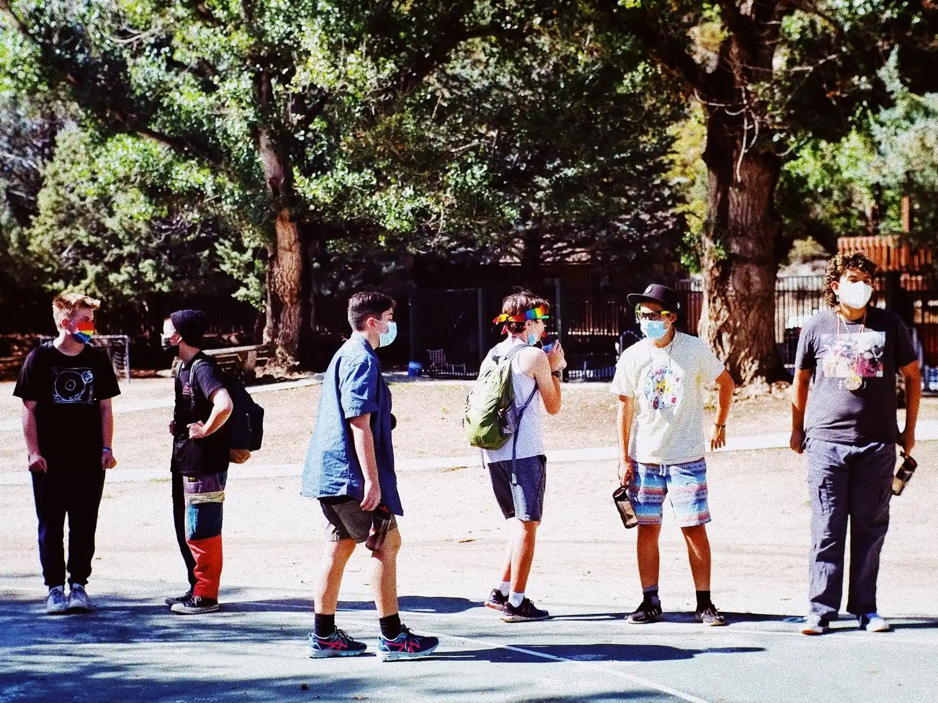 a group of people walking on a street