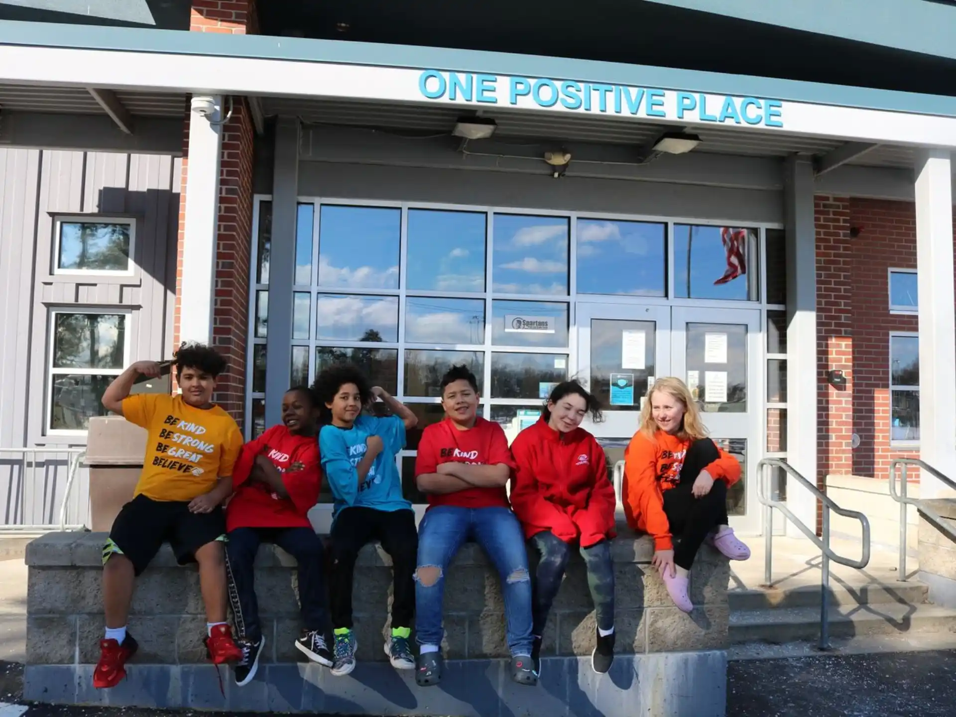 a group of people sitting on steps outside a building