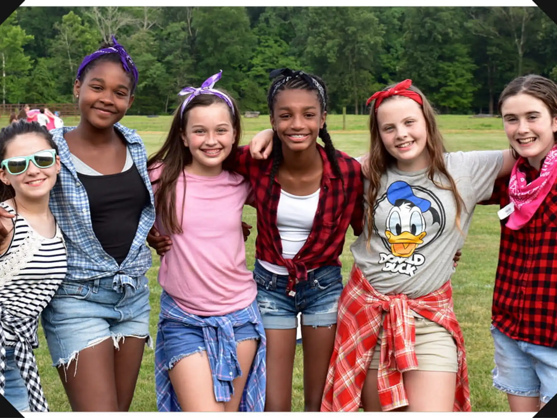 a group of girls posing for a photo