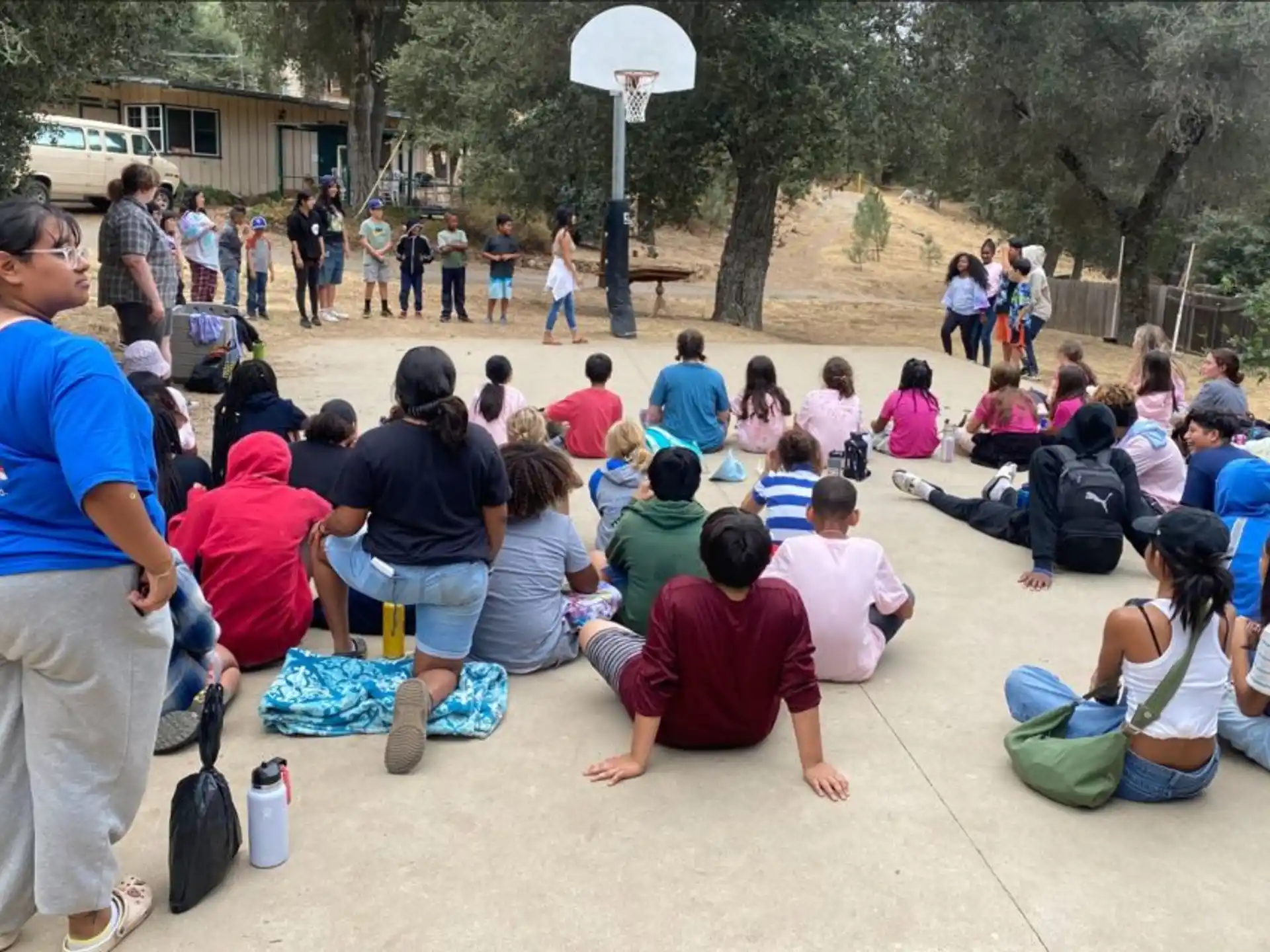 a group of people sitting on the ground