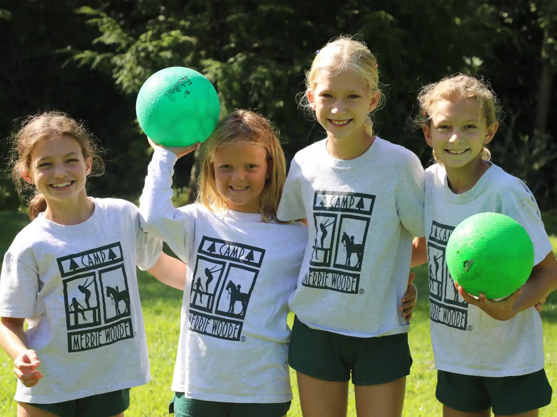 a group of children holding balloons