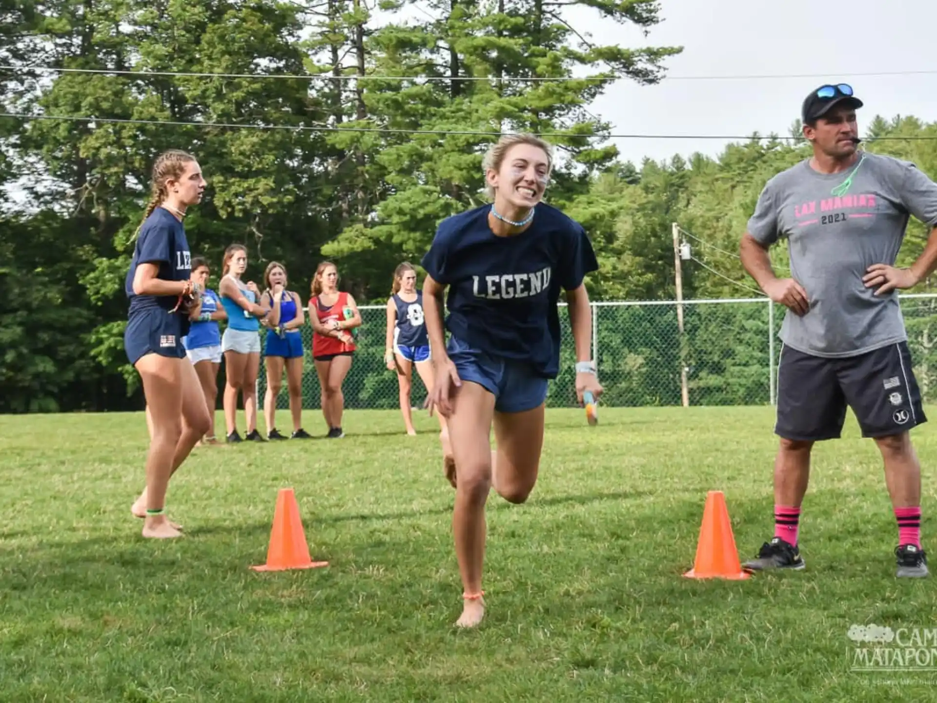 a group of people running on a field
