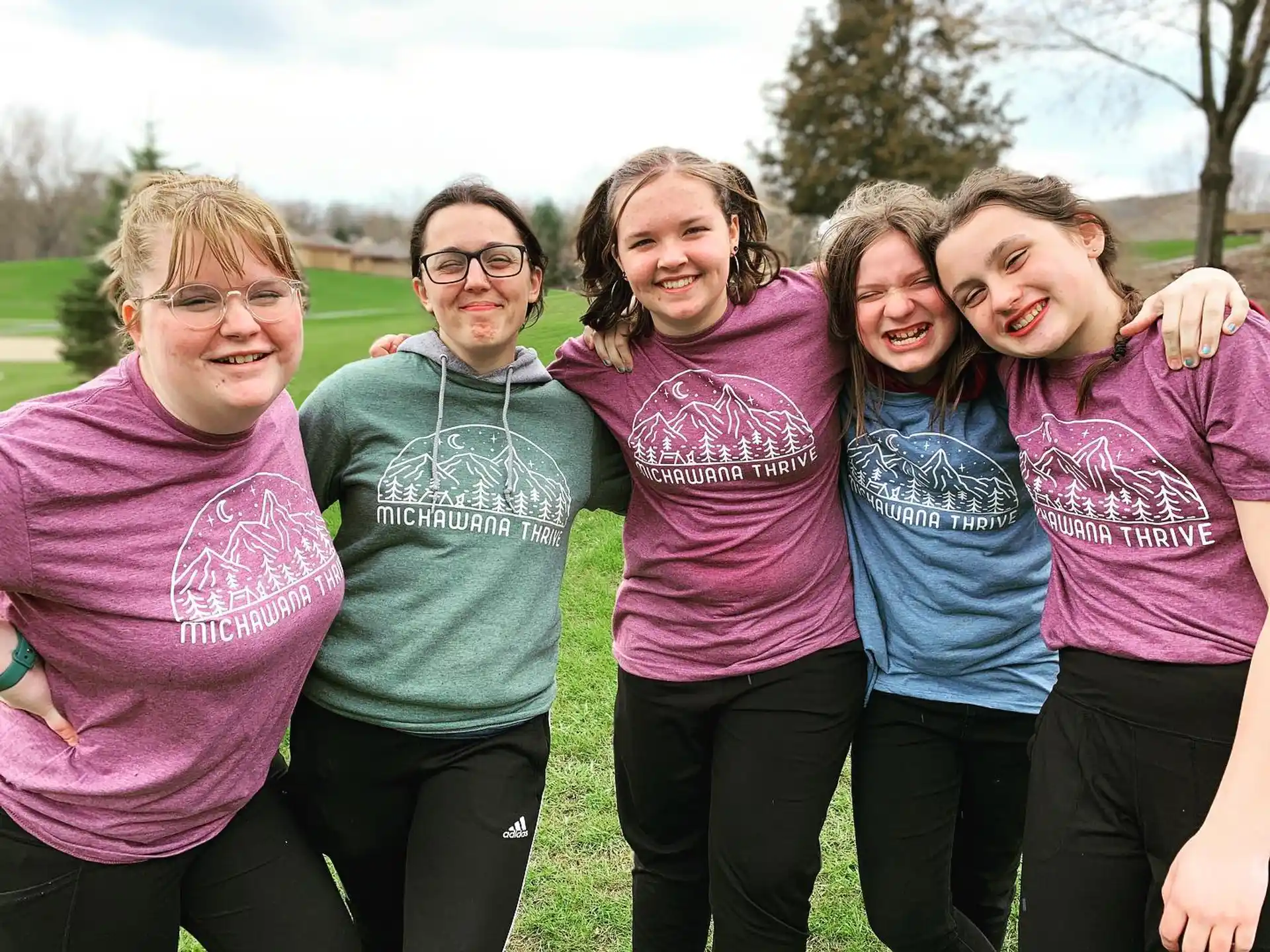 a group of women posing for a photo