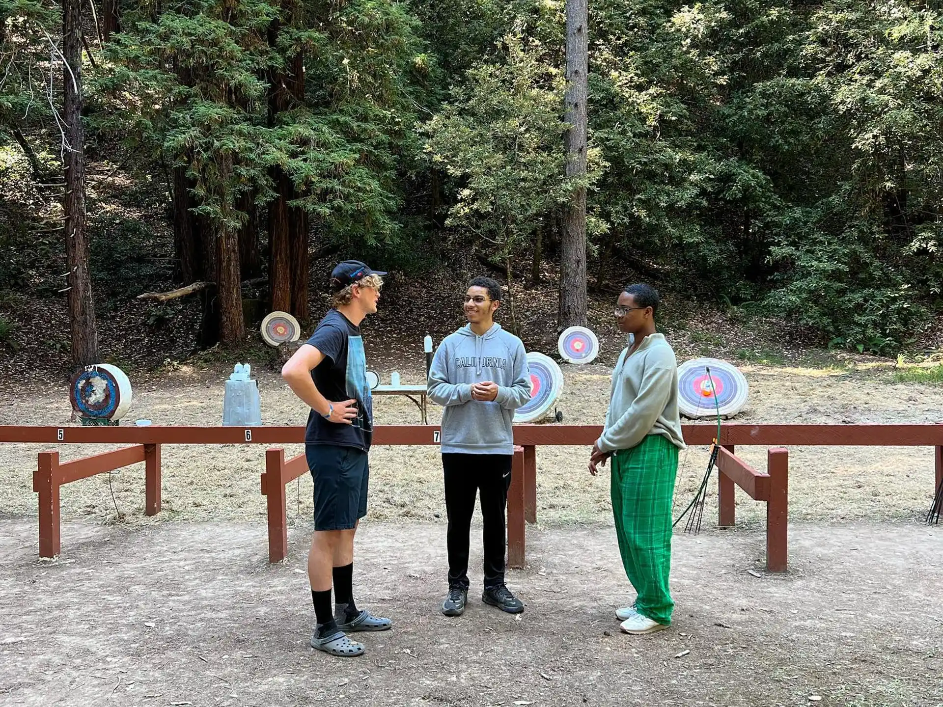 a group of people holding frisbees