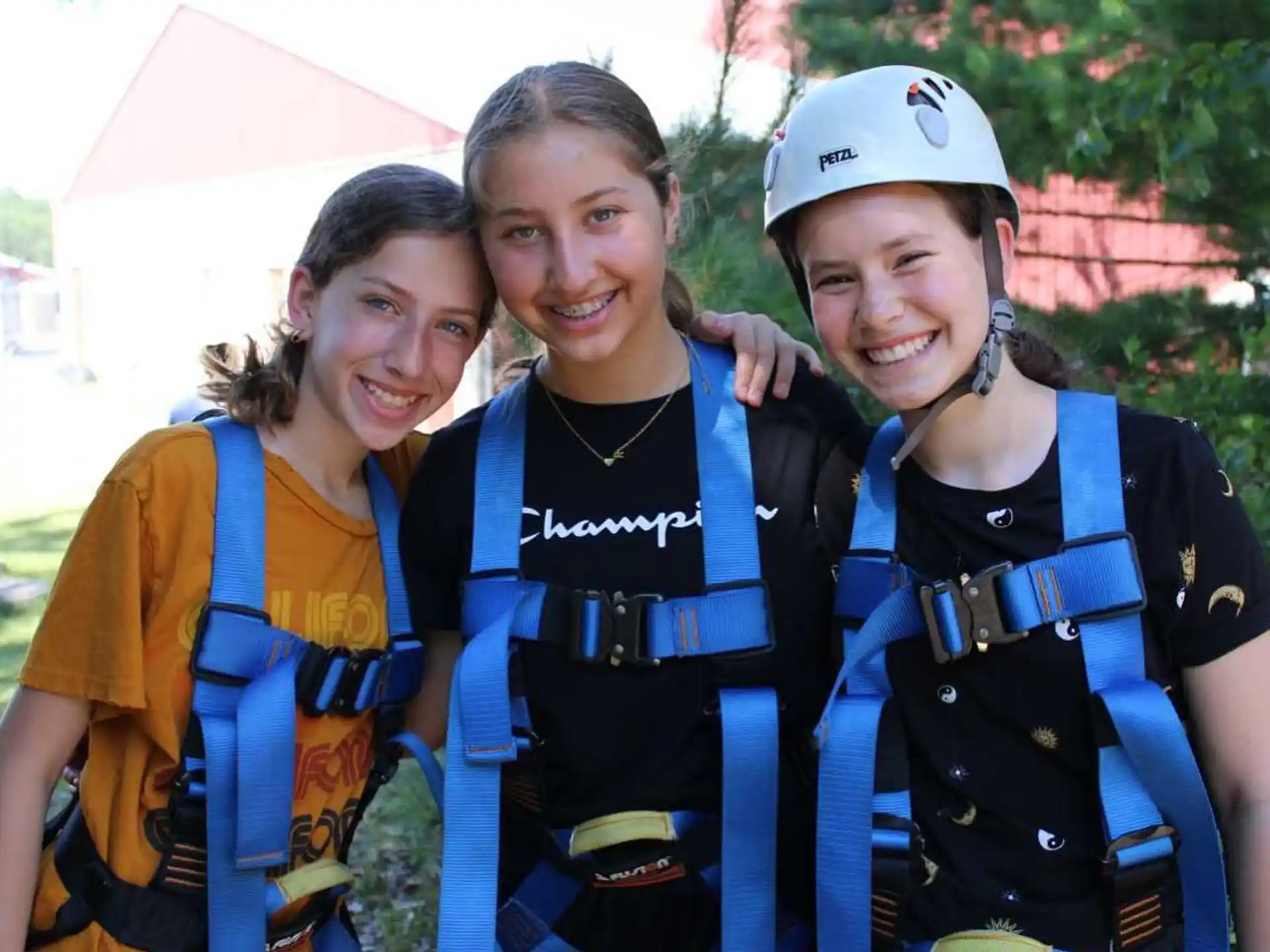 a group of women wearing life vests and standing outside