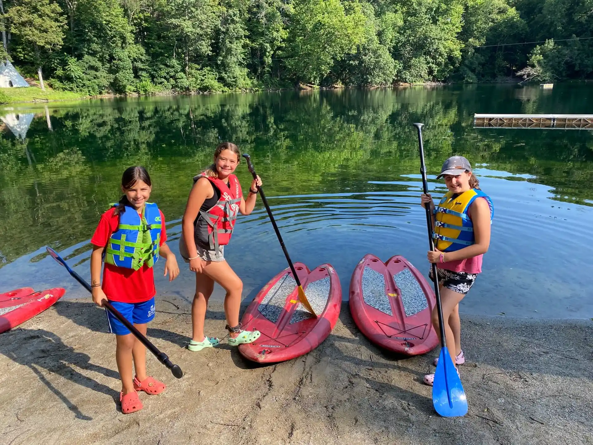 a group of people holding paddles