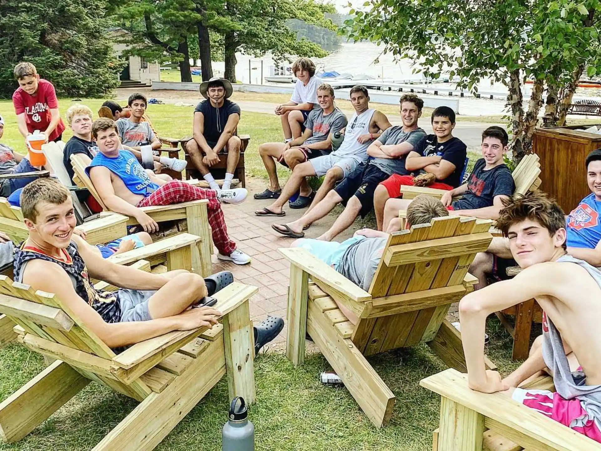 a group of people sitting on wooden benches
