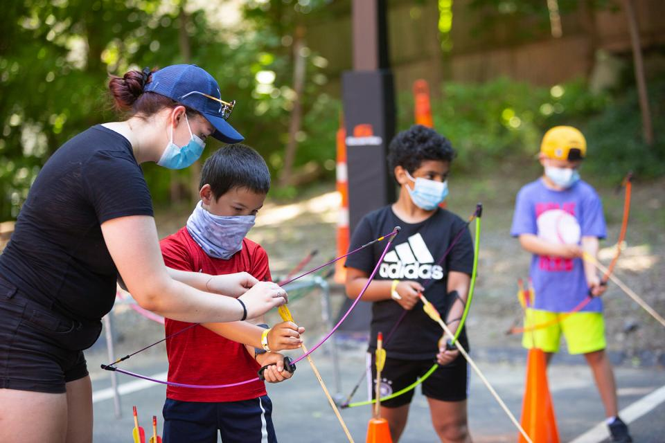 a group of kids wearing face masks