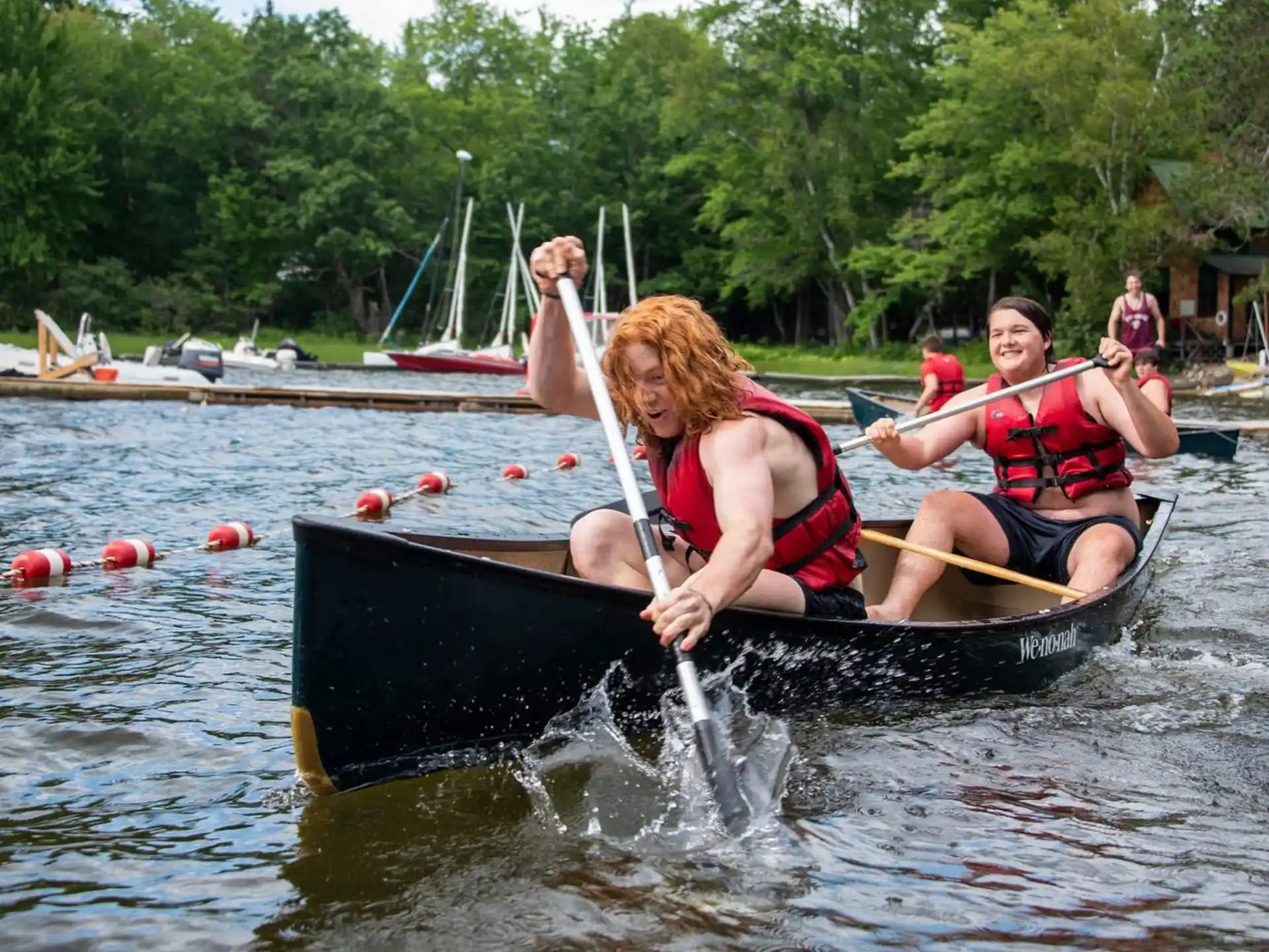 a group of people in a canoe