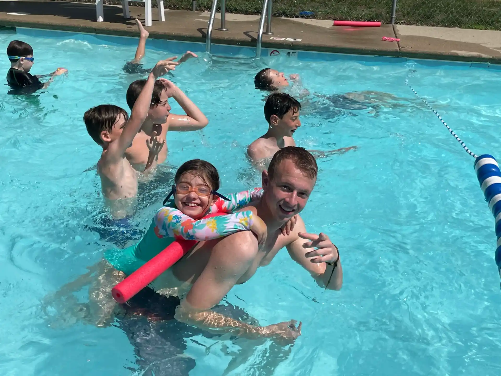 a group of people in a pool