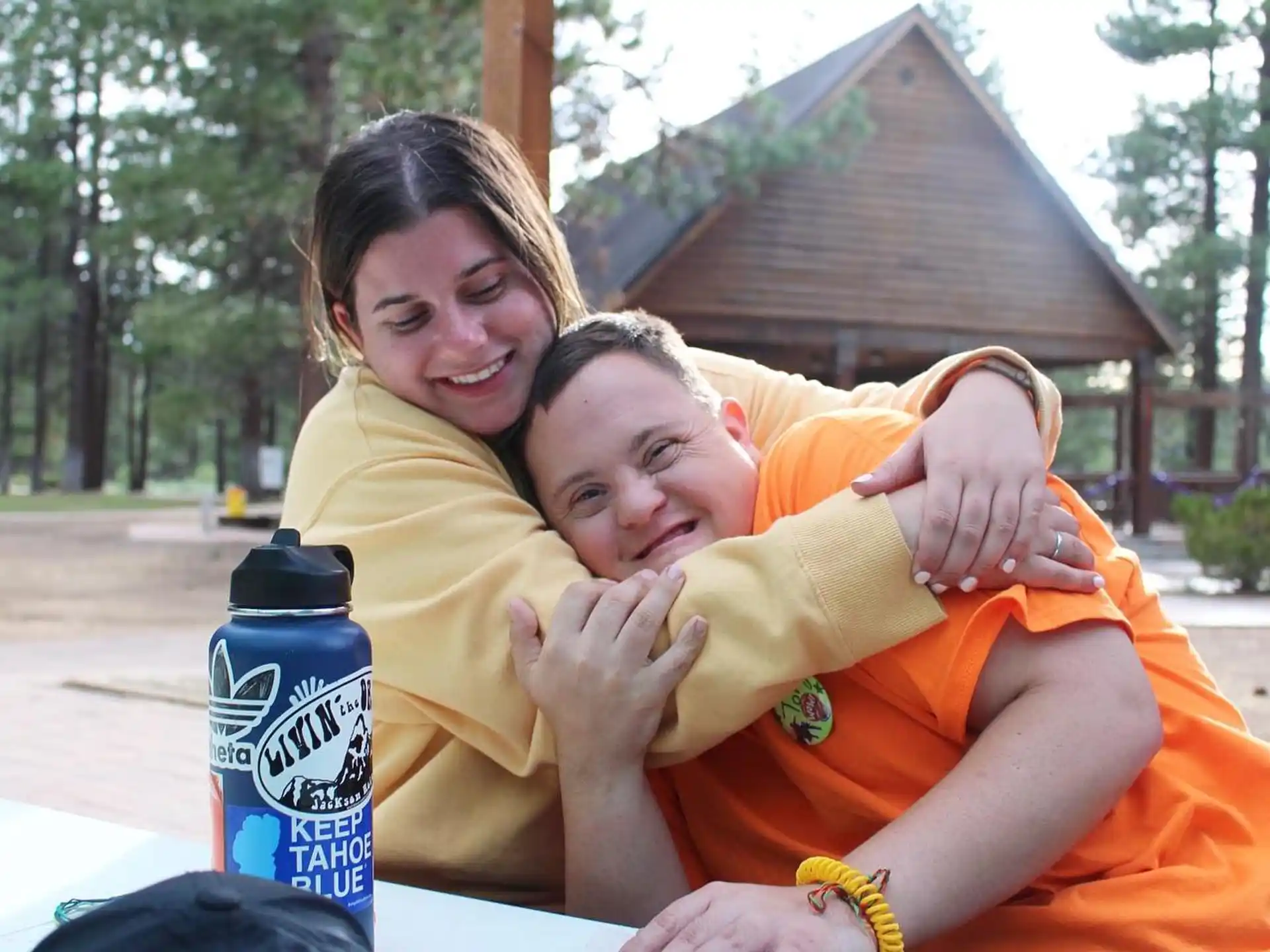a woman hugging a man