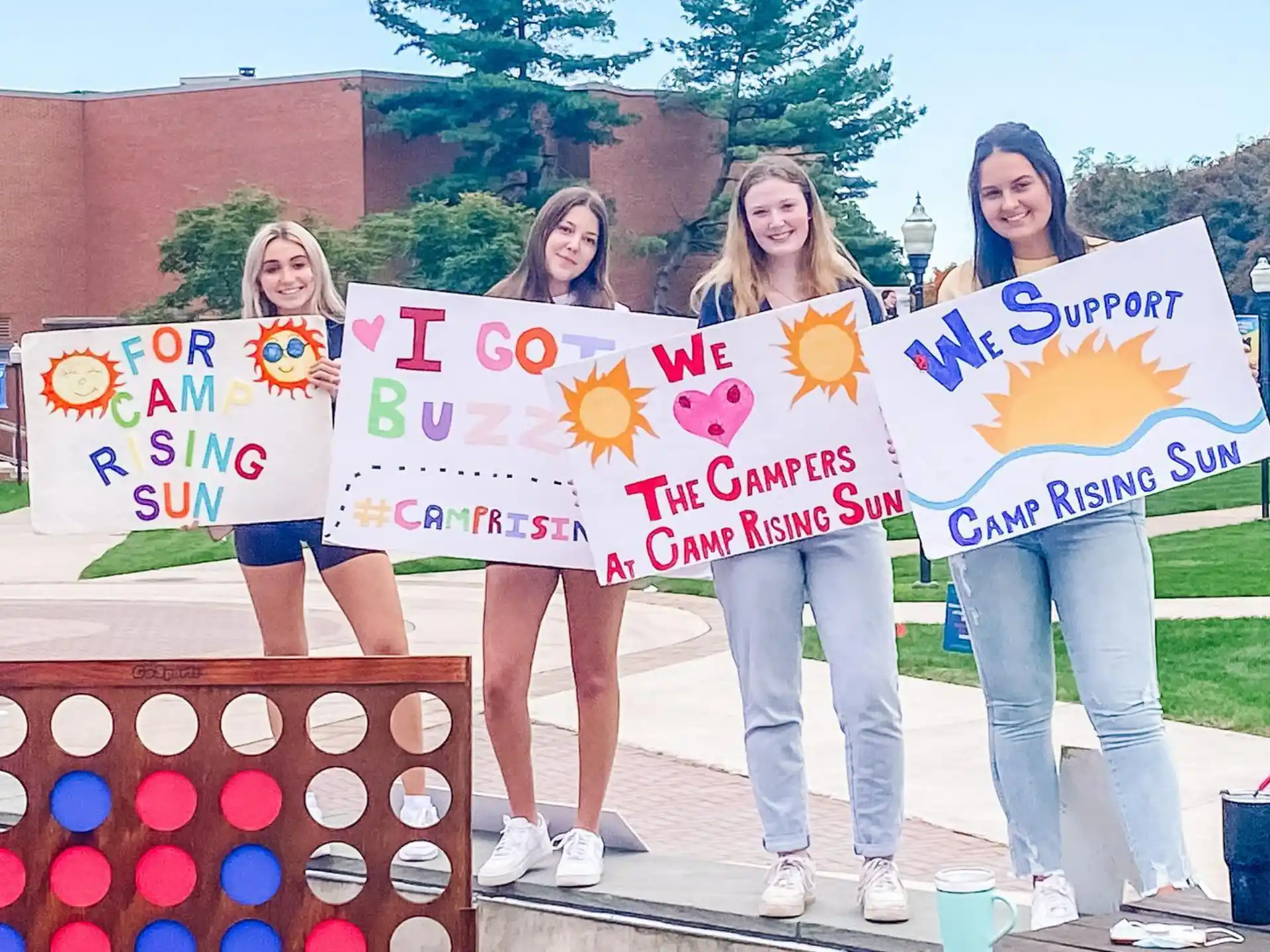 a group of women holding signs