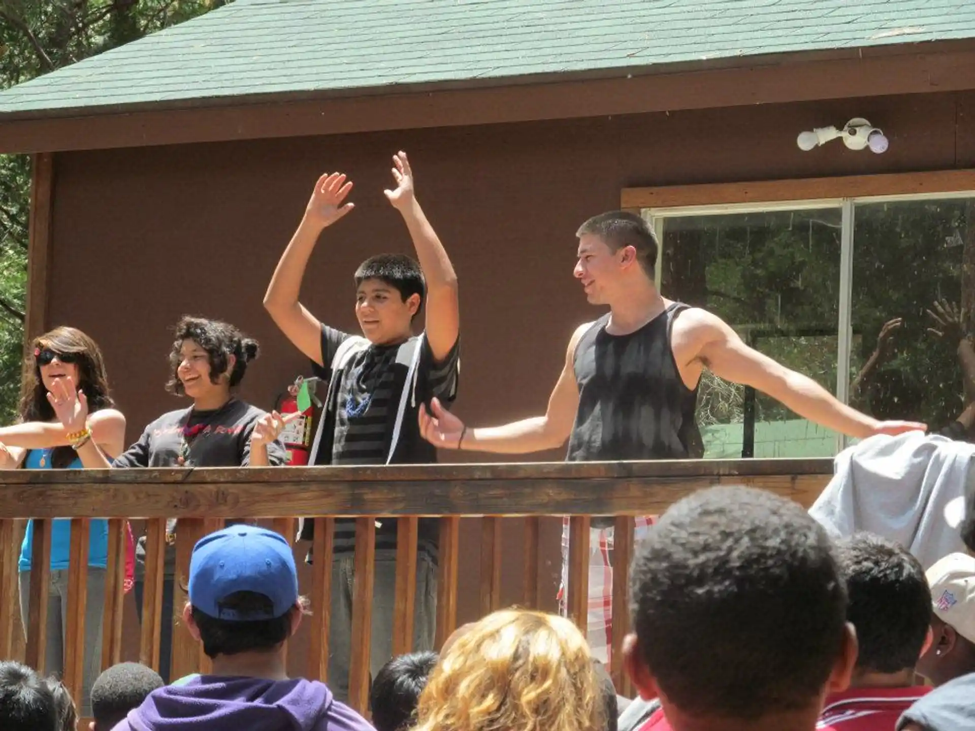 a group of people on a balcony