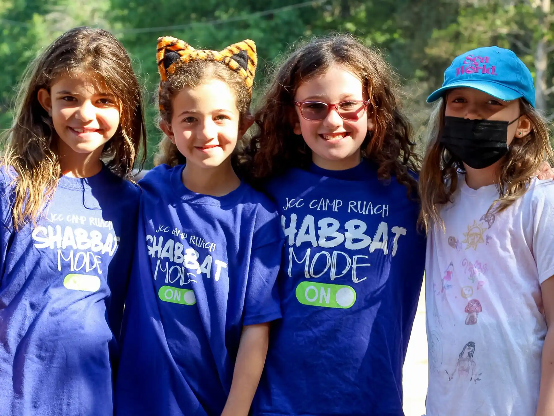 a group of girls wearing face masks