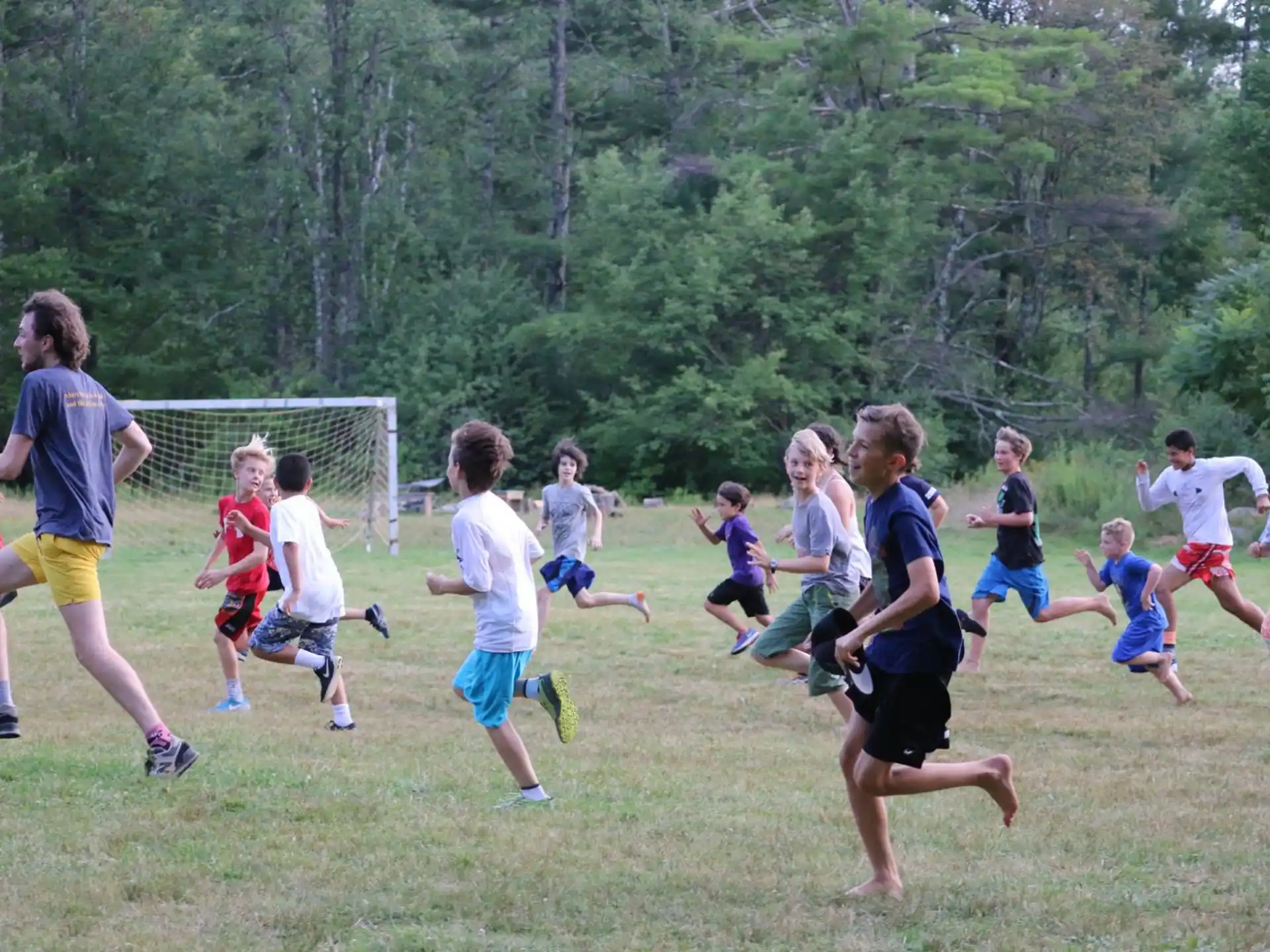 a group of kids playing football