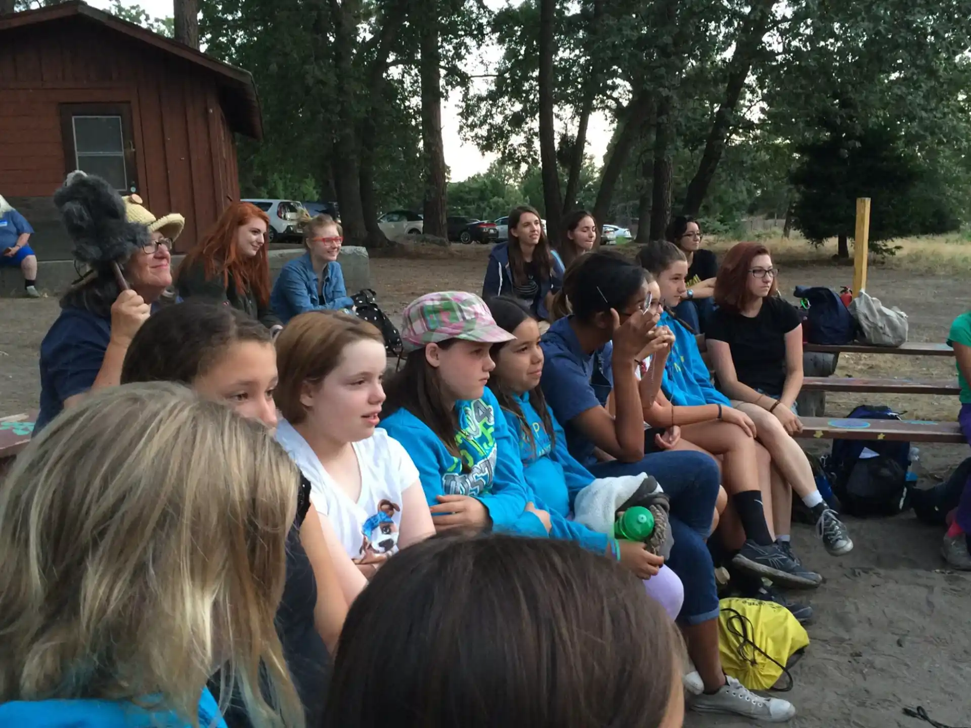 a group of people sitting on a bench