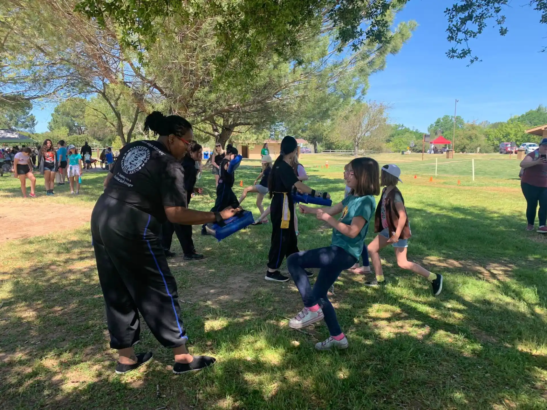 a group of people playing in a park