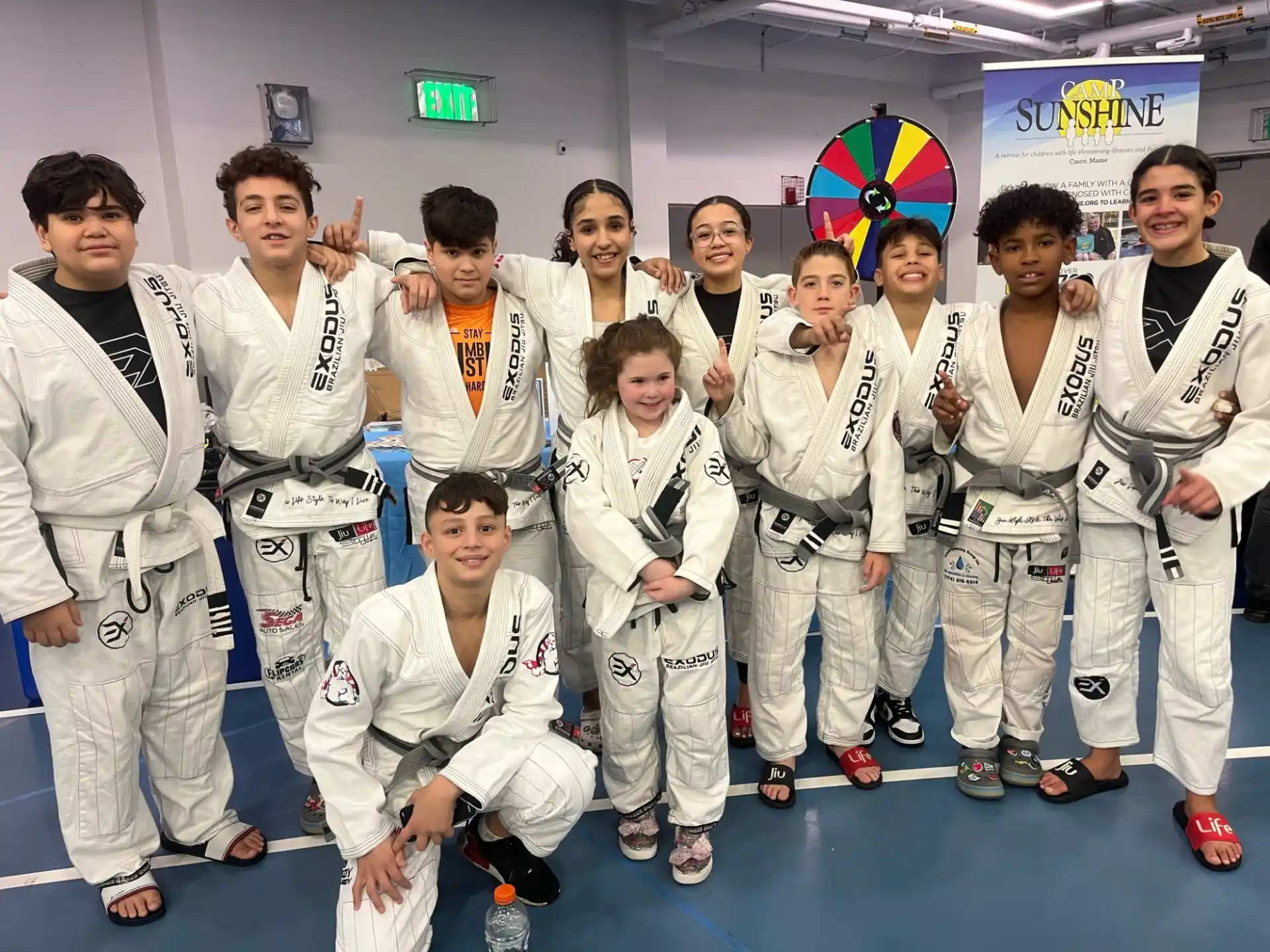 a group of people in karate uniforms