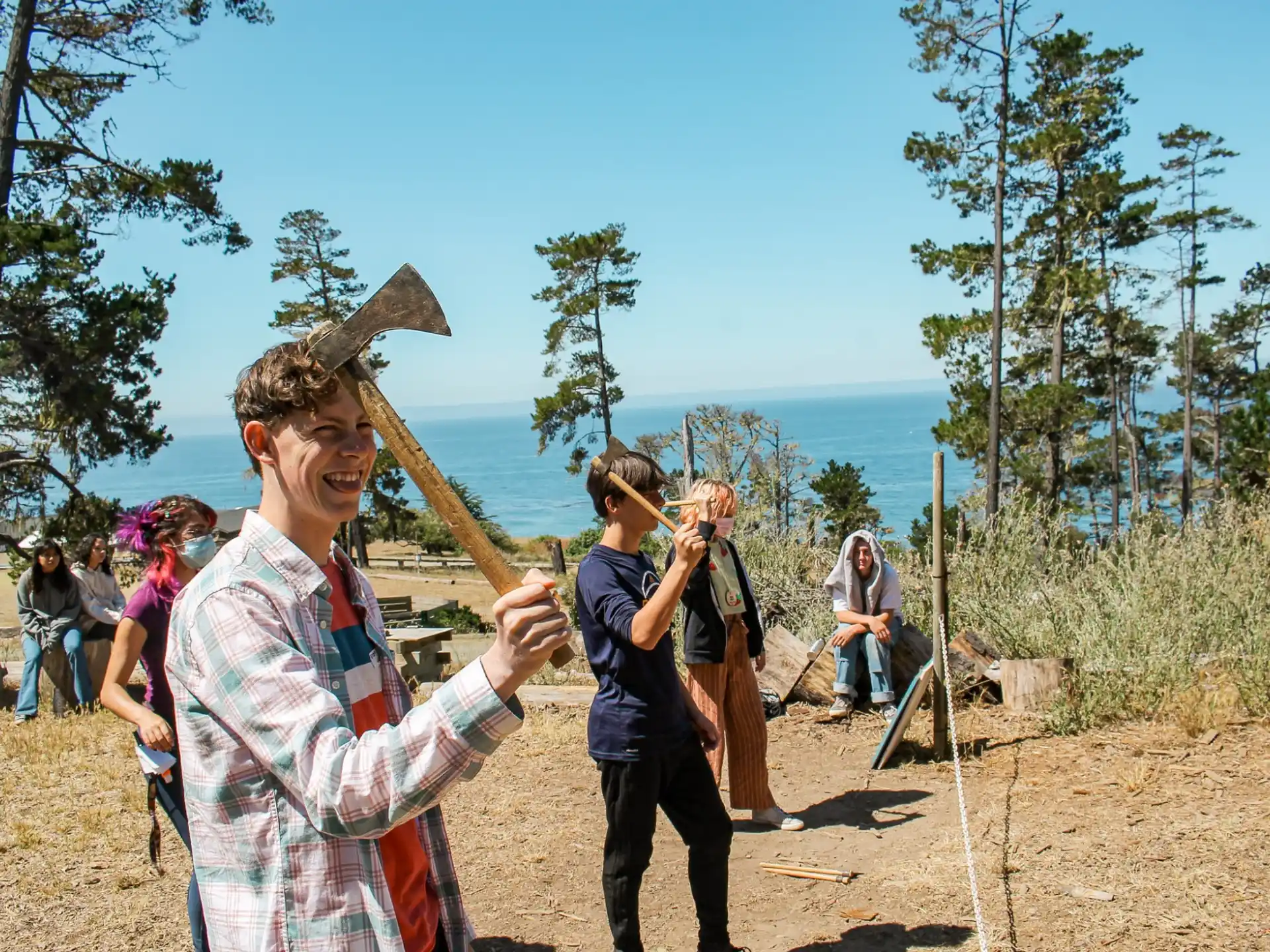 a group of people holding bows and arrows
