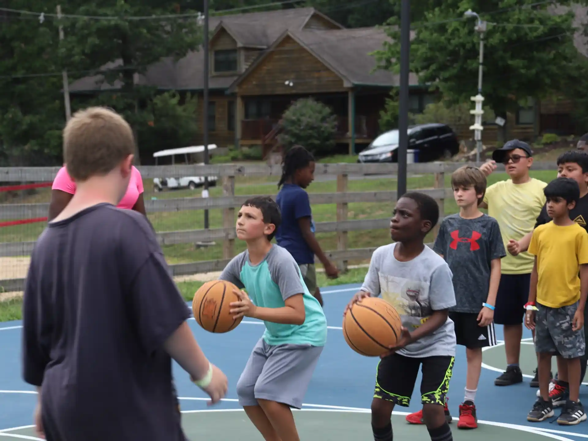 a group of kids playing basketball