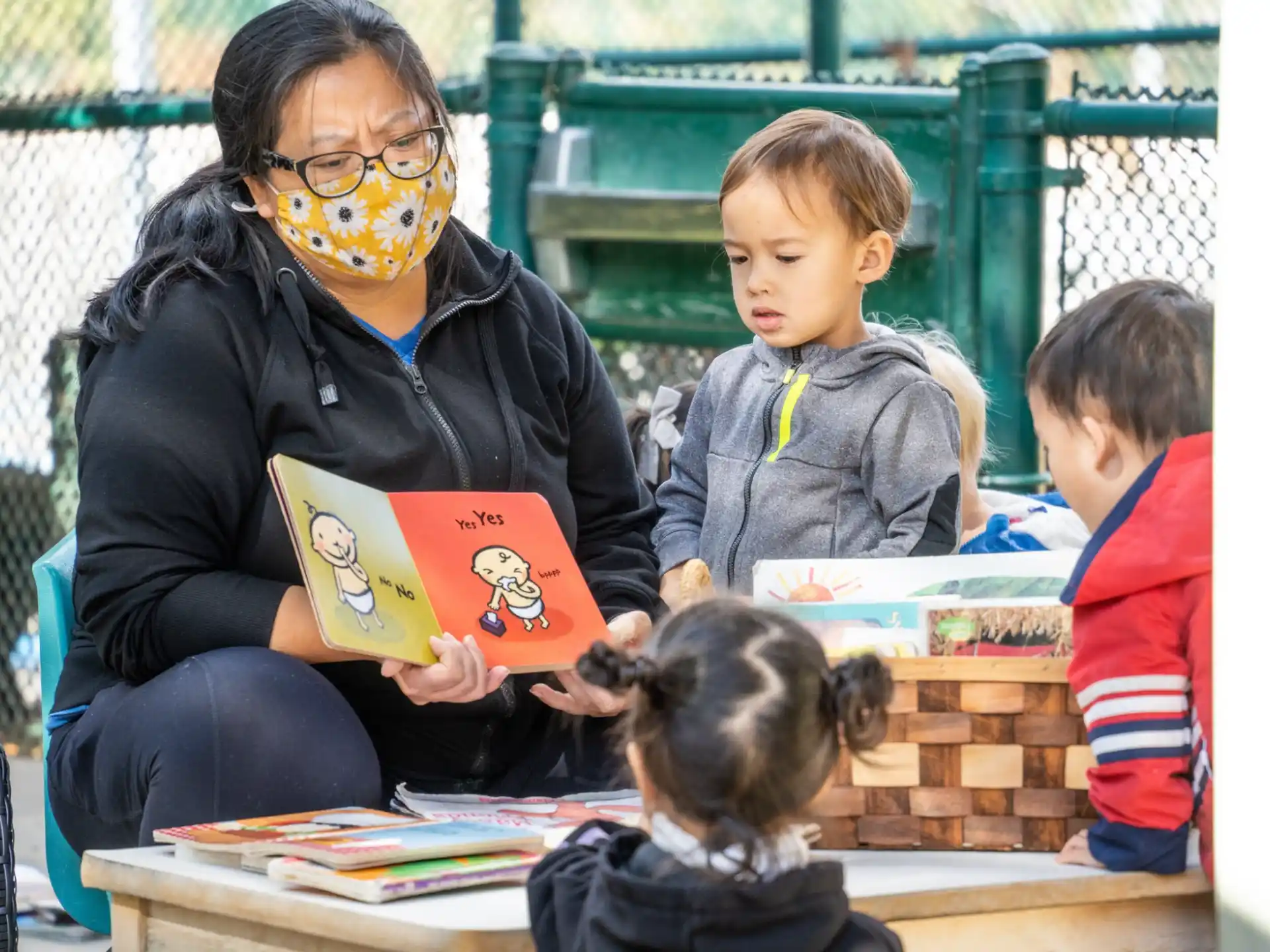 a person and children with a mask